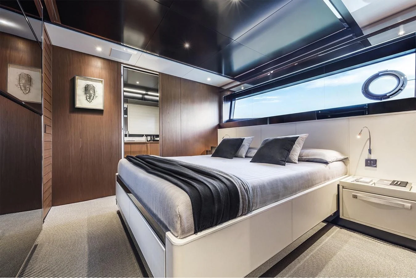 a room with a bed and a desk aboard RIVA 90' ARGO Yacht for Sale