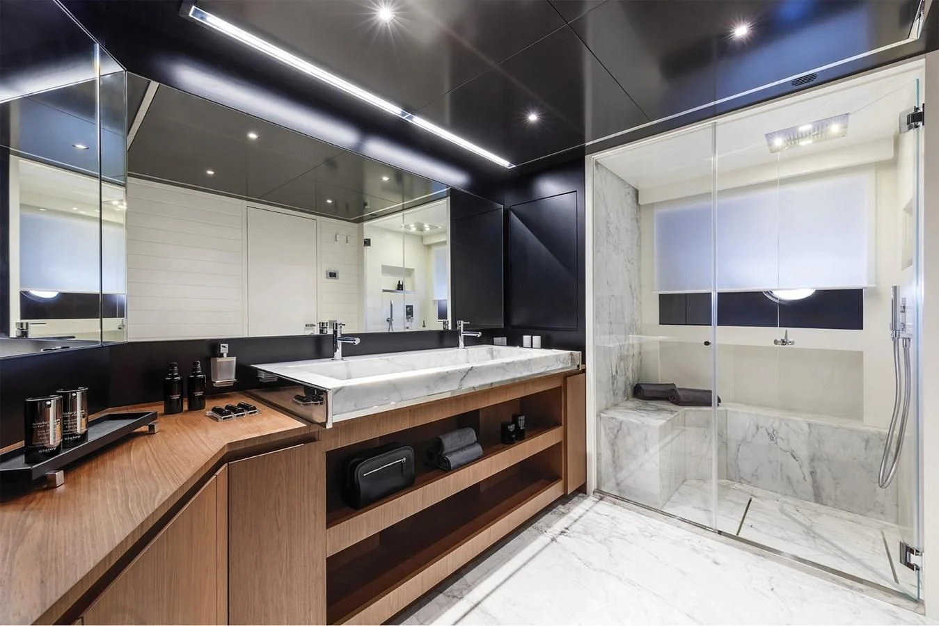 a bathroom with a large mirror aboard RIVA 90' ARGO Yacht for Sale