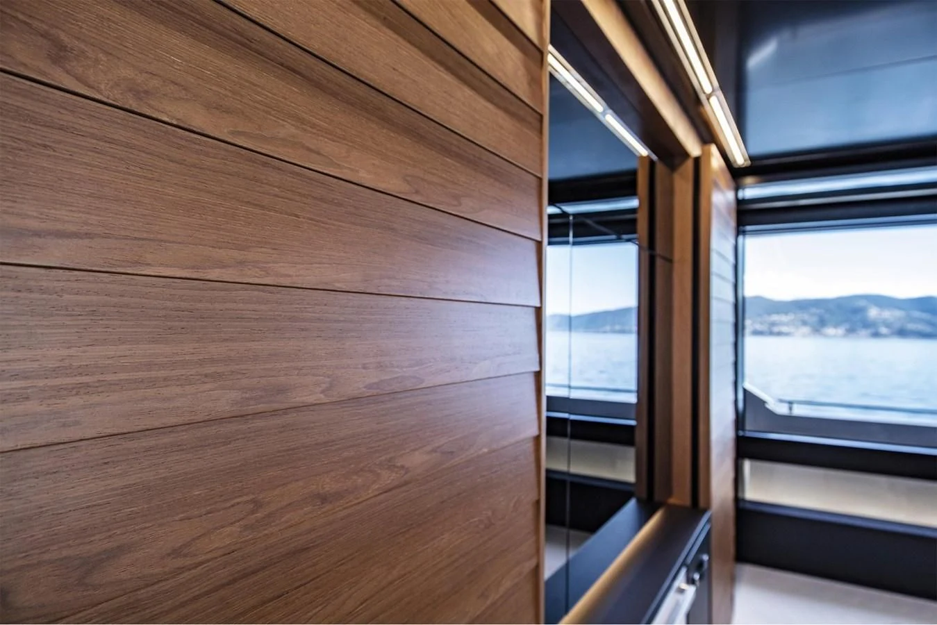 a wooden room with a window aboard RIVA 90' ARGO Yacht for Sale