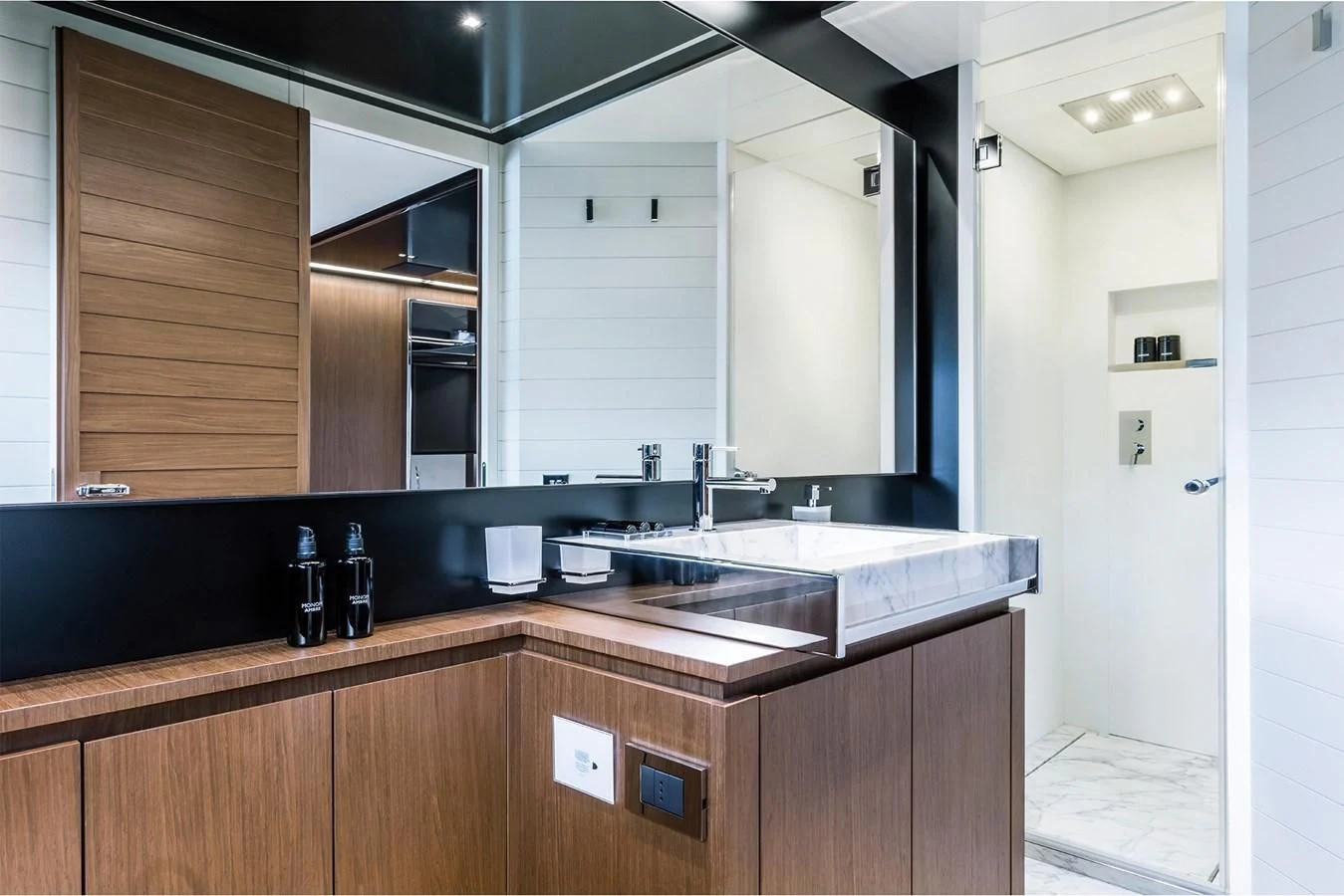 a kitchen with a sink and cabinets aboard RIVA 90' ARGO Yacht for Sale