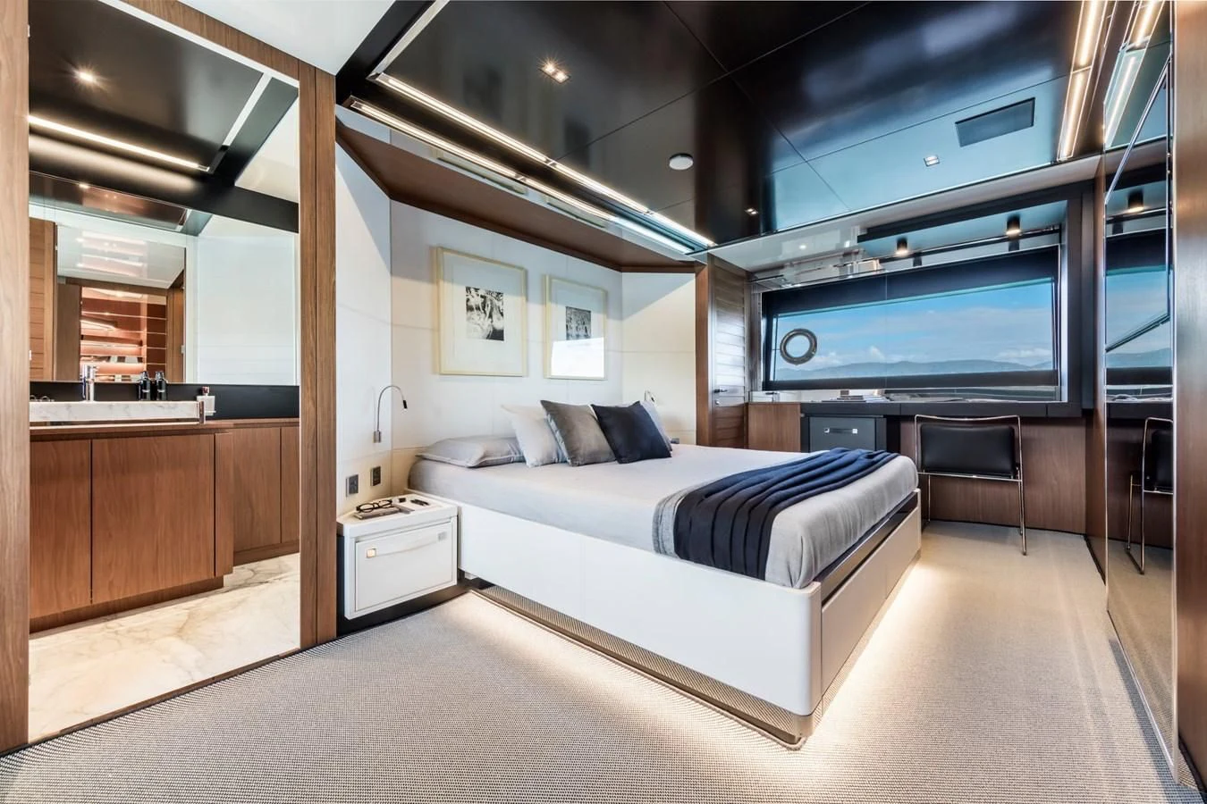 a room with a bed and a tv aboard RIVA 90' ARGO Yacht for Sale
