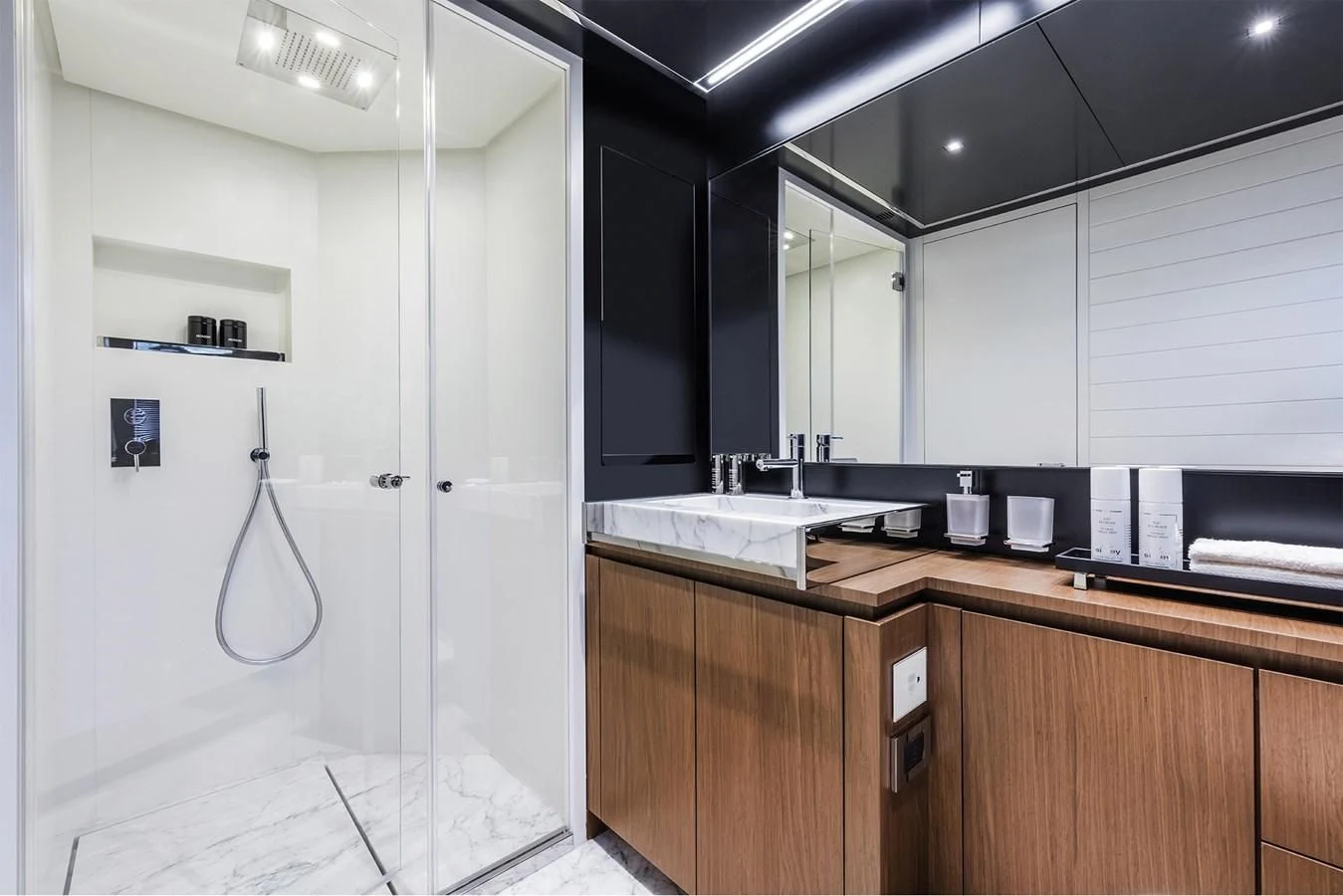 a kitchen with a refrigerator and sink aboard RIVA 90' ARGO Yacht for Sale