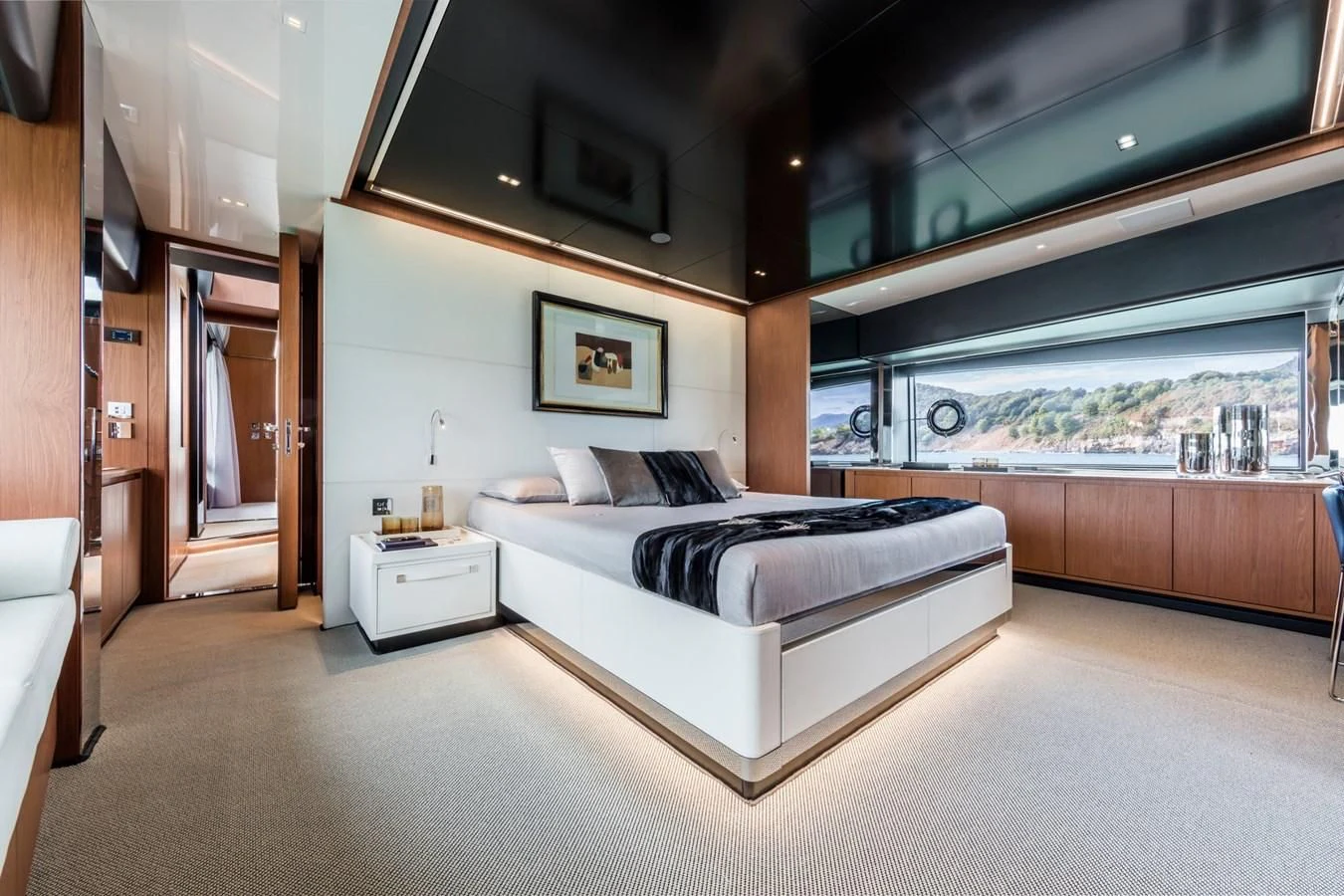 a bedroom with a large bed aboard RIVA 90' ARGO Yacht for Sale