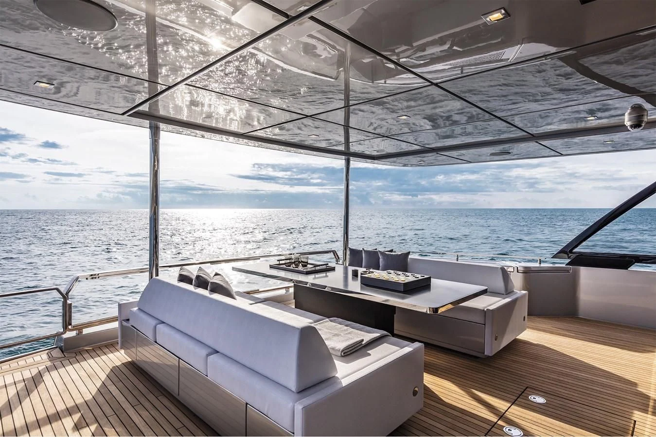 a large white bed on a deck aboard RIVA 90' ARGO Yacht for Sale