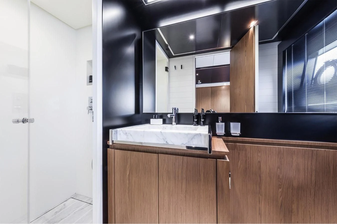 a kitchen with a sink and cabinets aboard RIVA 90' ARGO Yacht for Sale