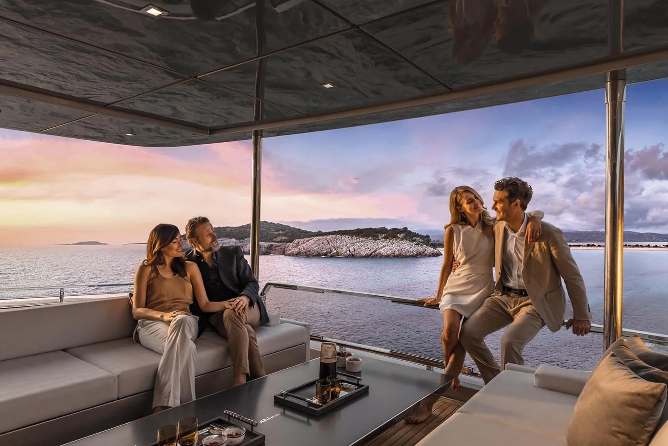 a group of people sitting on a boat aboard RIVA 90' ARGO Yacht for Sale