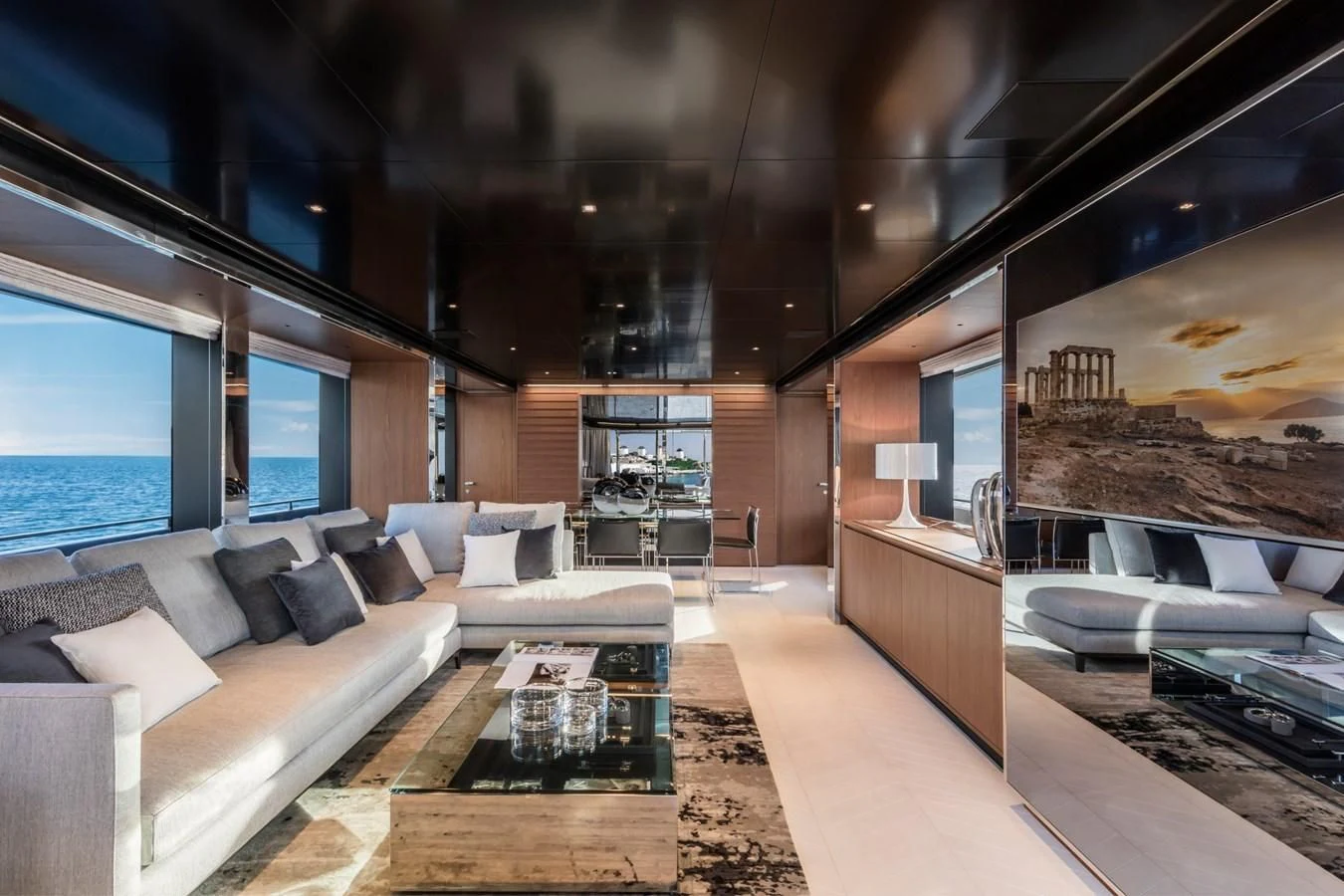 a living room with a large fireplace aboard RIVA 90' ARGO Yacht for Sale