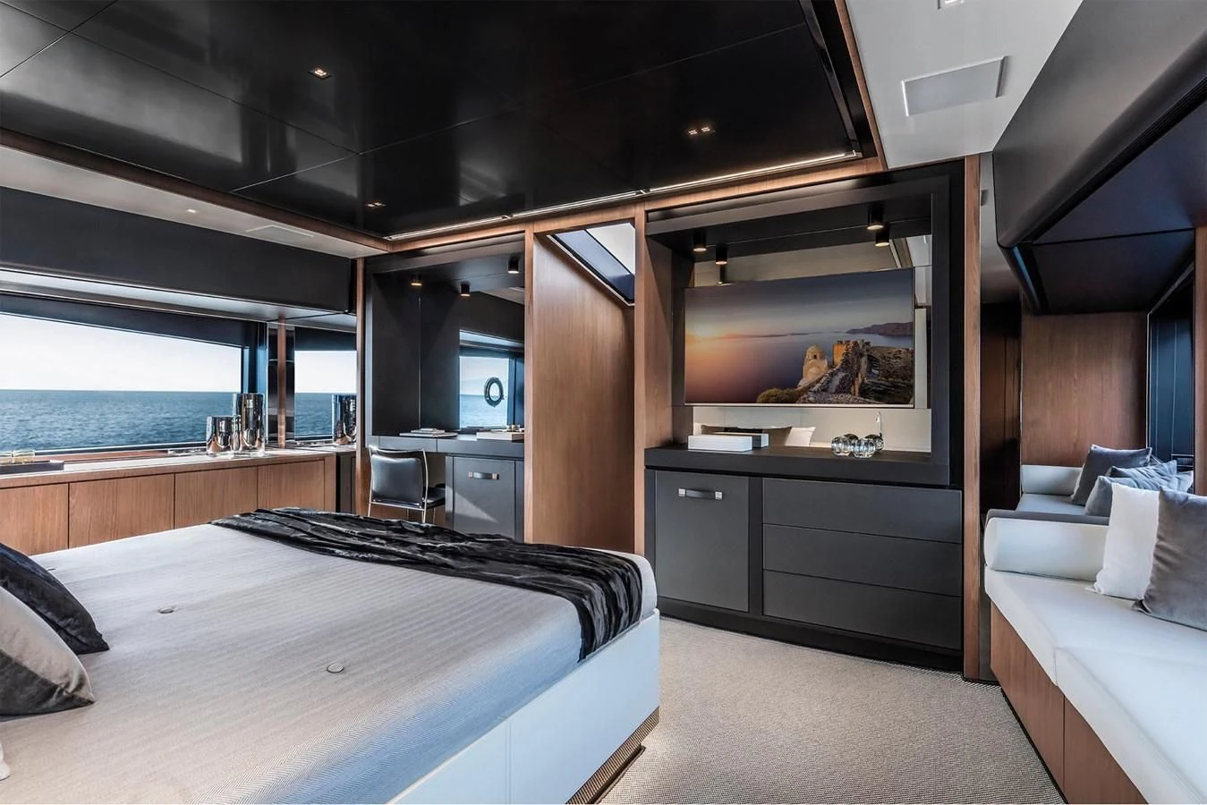 a room with a bed and a television aboard RIVA 90' ARGO Yacht for Sale