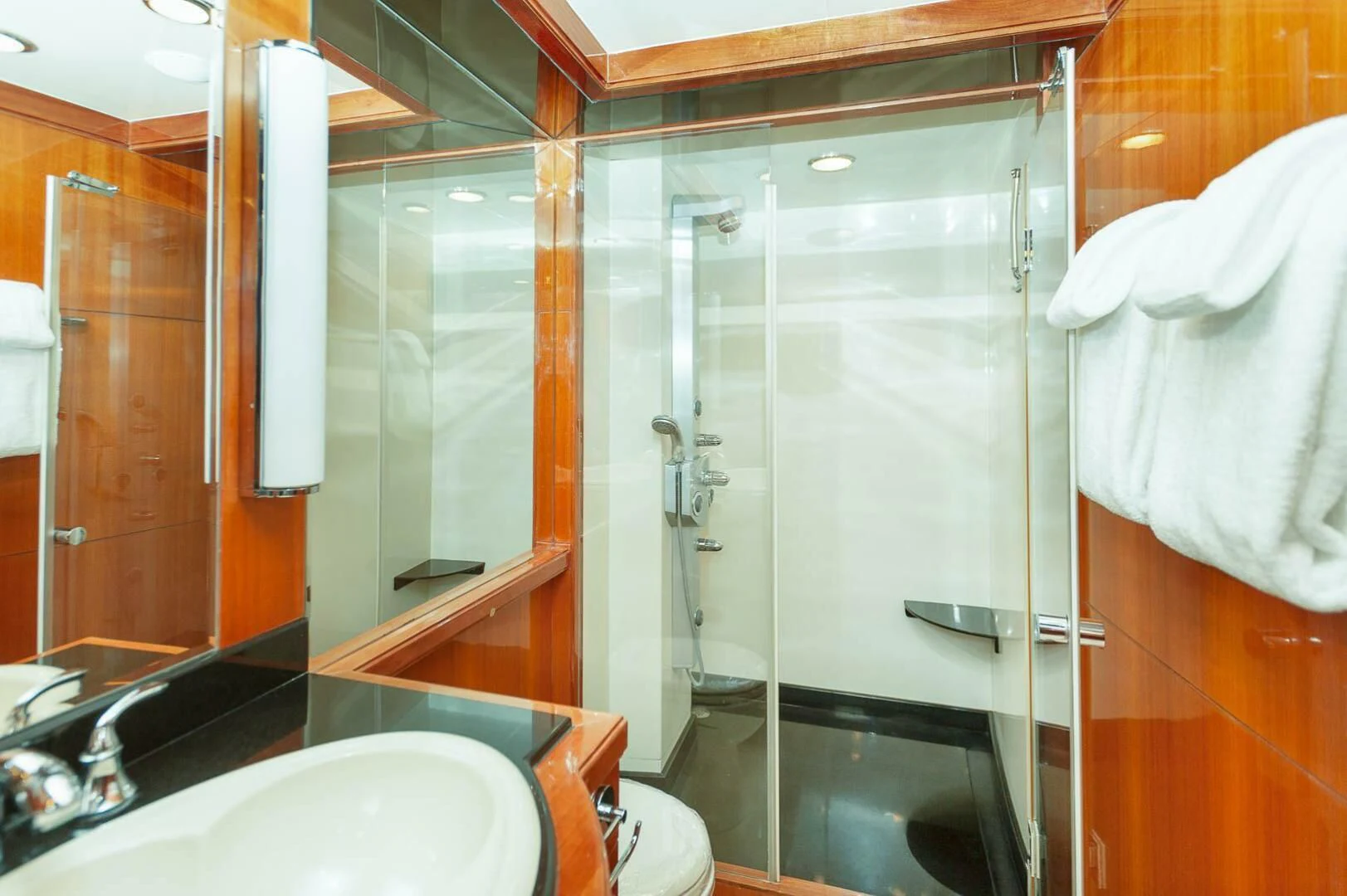 a bathroom with a glass shower aboard COCONUT Yacht for Sale