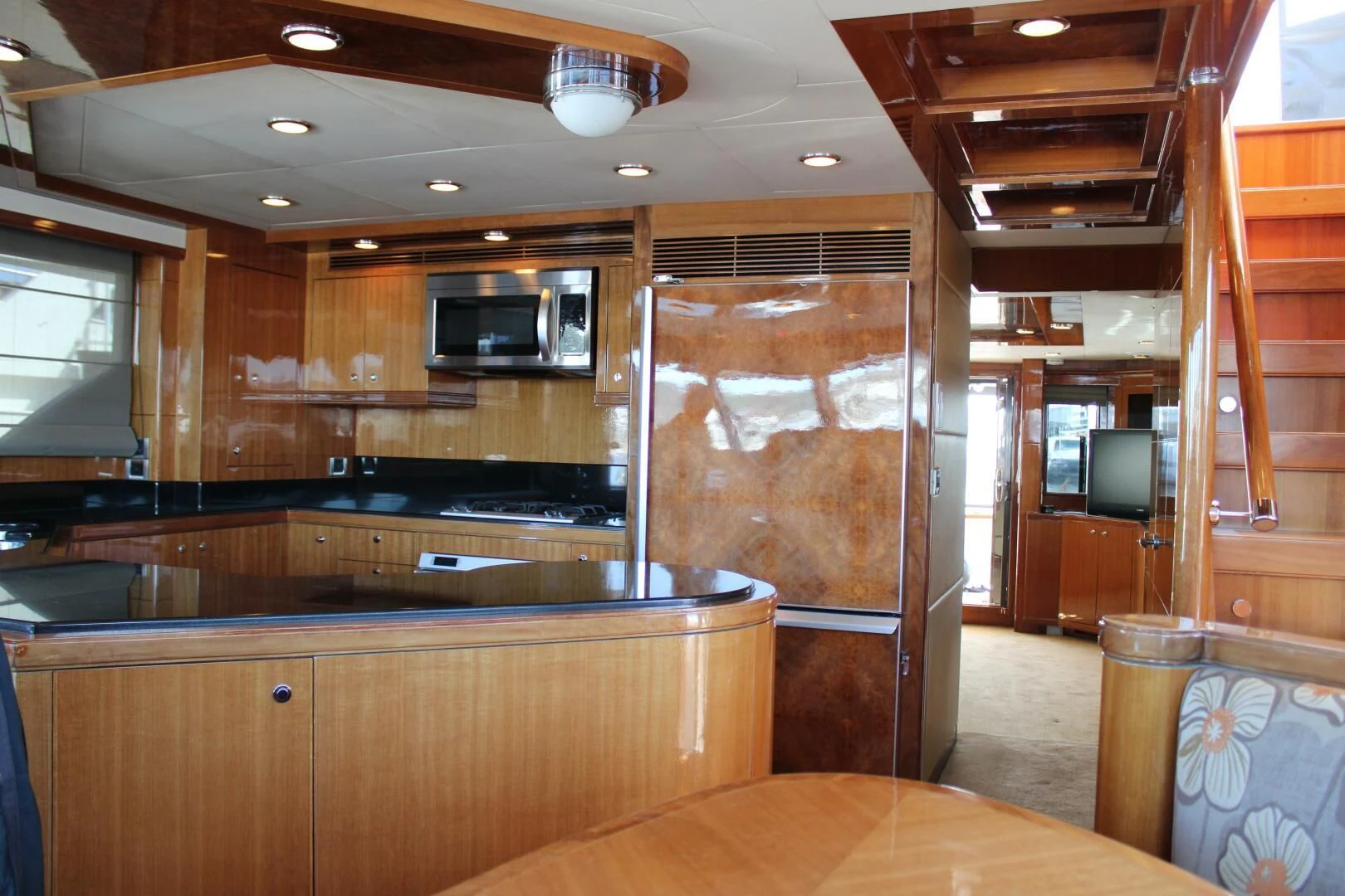 a kitchen with wooden cabinets aboard COCONUT Yacht for Sale