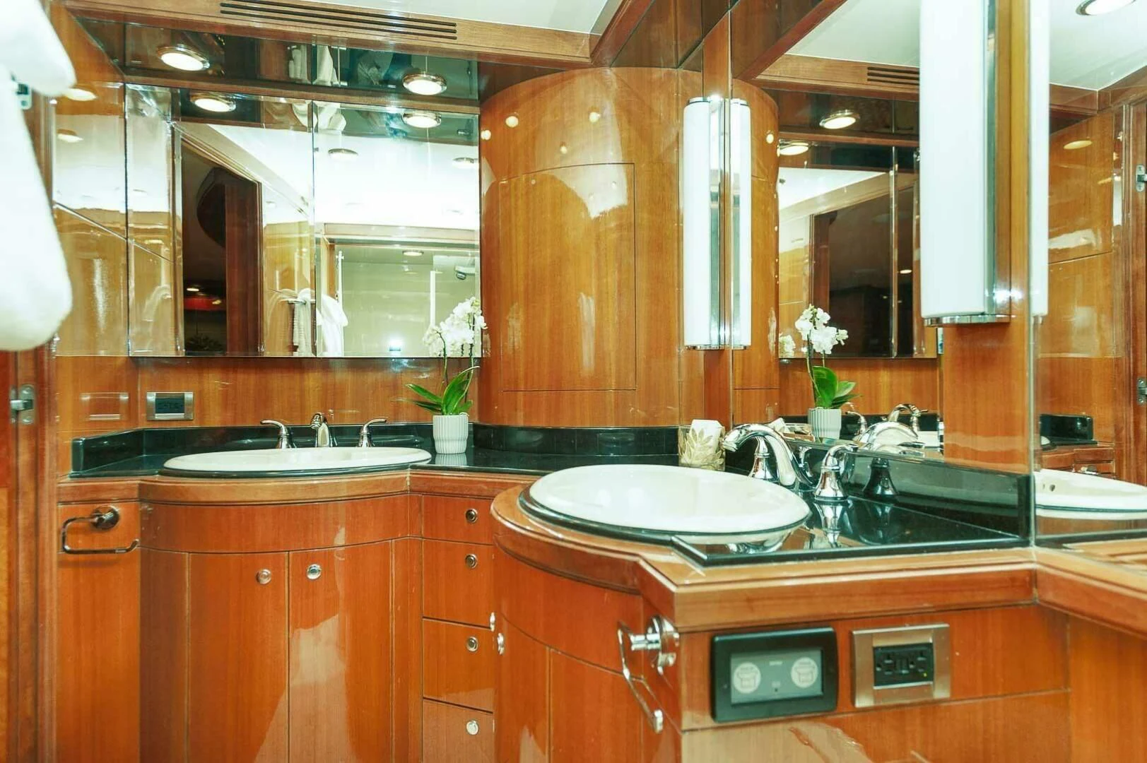 a bathroom with a sink and a mirror aboard COCONUT Yacht for Sale