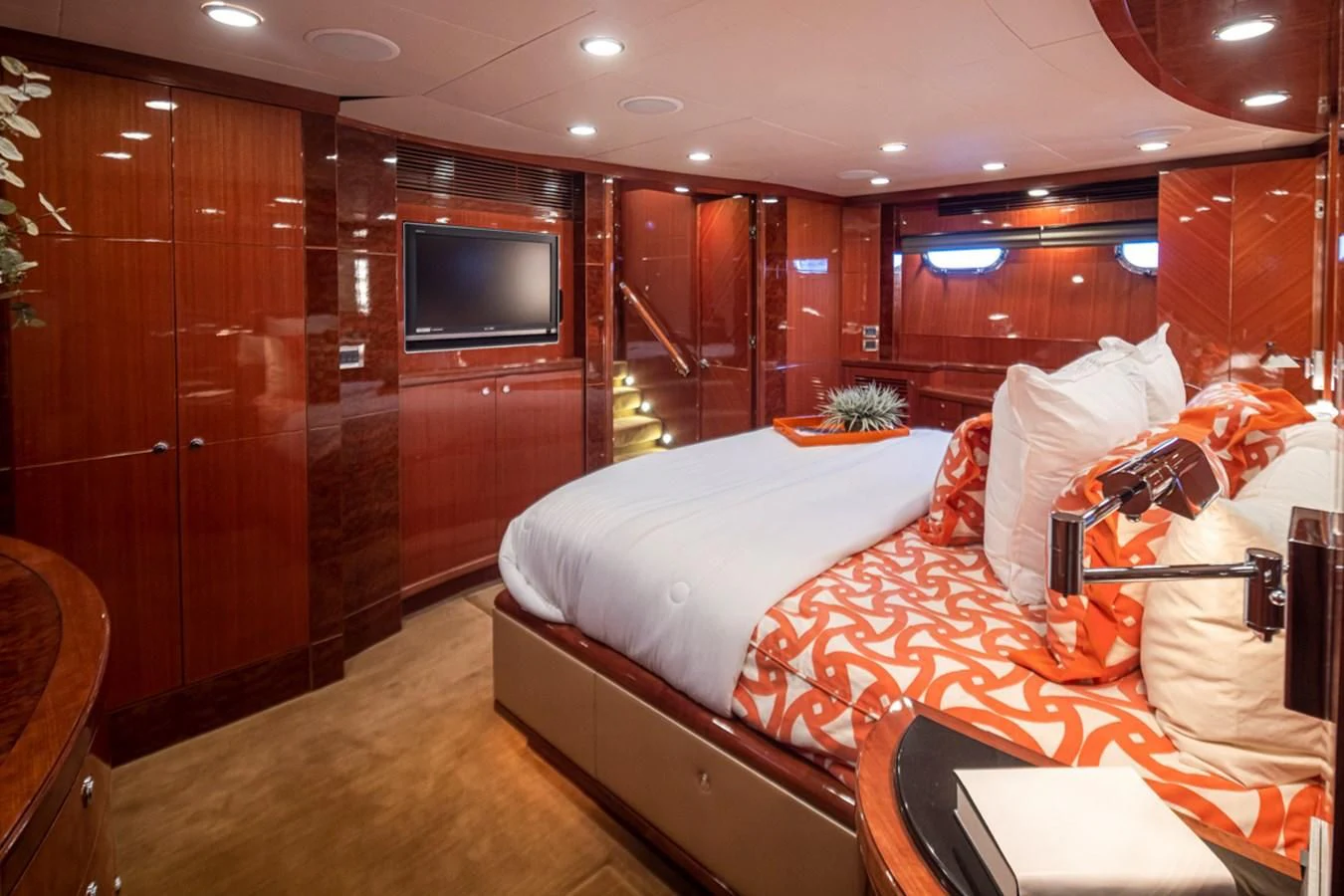a bedroom with a bed and a television aboard COCONUT Yacht for Sale
