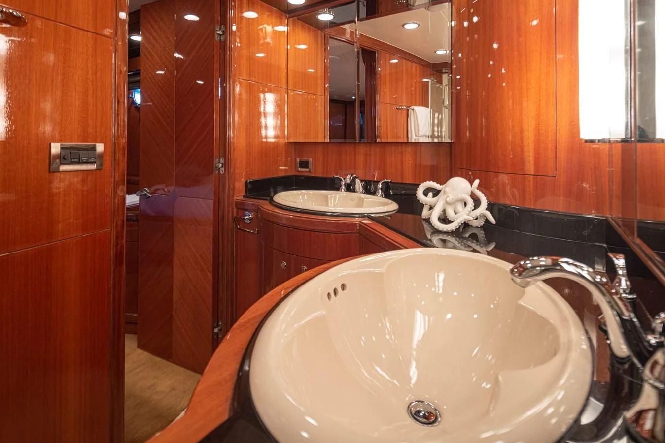 a bathroom with a sink and a mirror aboard COCONUT Yacht for Sale