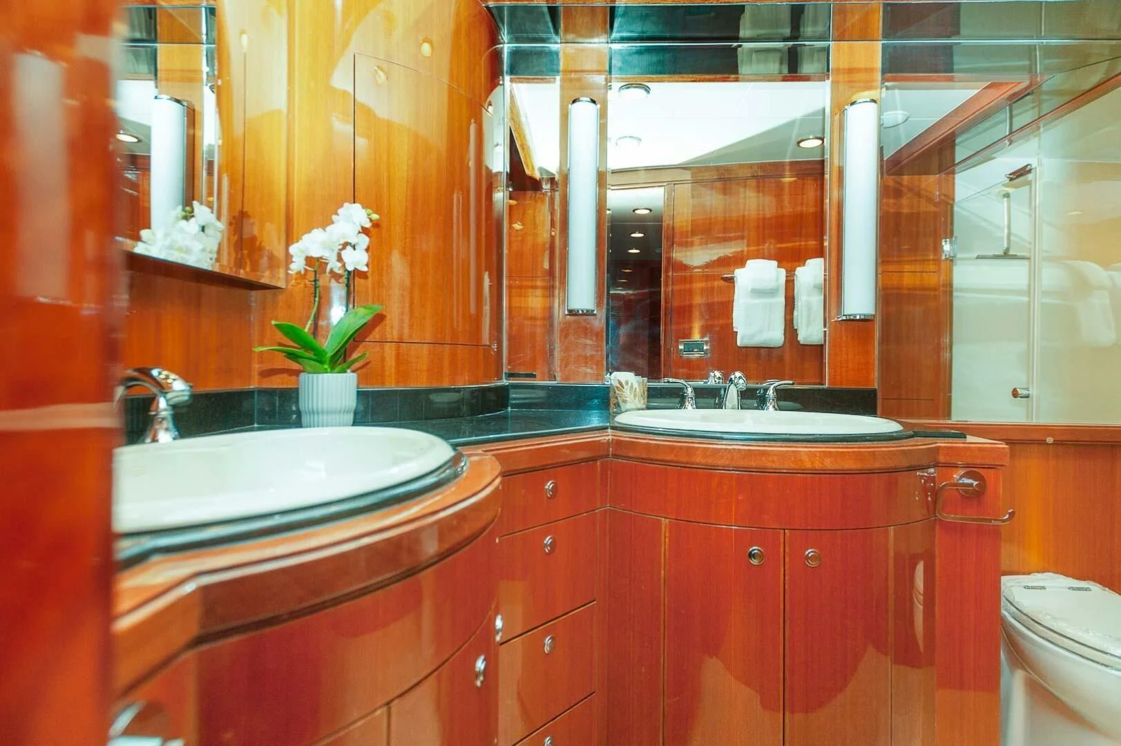 a bathroom with red cabinets aboard COCONUT Yacht for Sale