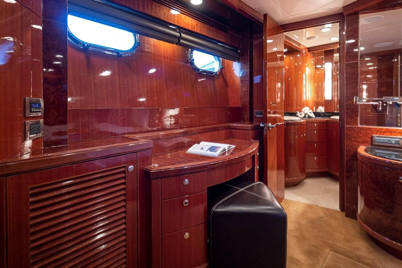 a room with a desk and cabinets aboard COCONUT Yacht for Sale