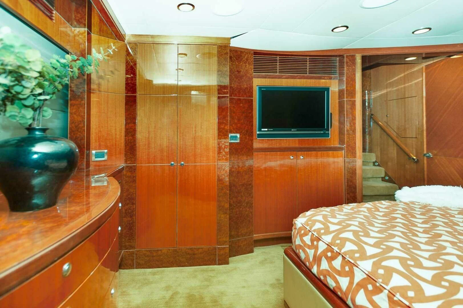 a room with a bed and a tv aboard COCONUT Yacht for Sale