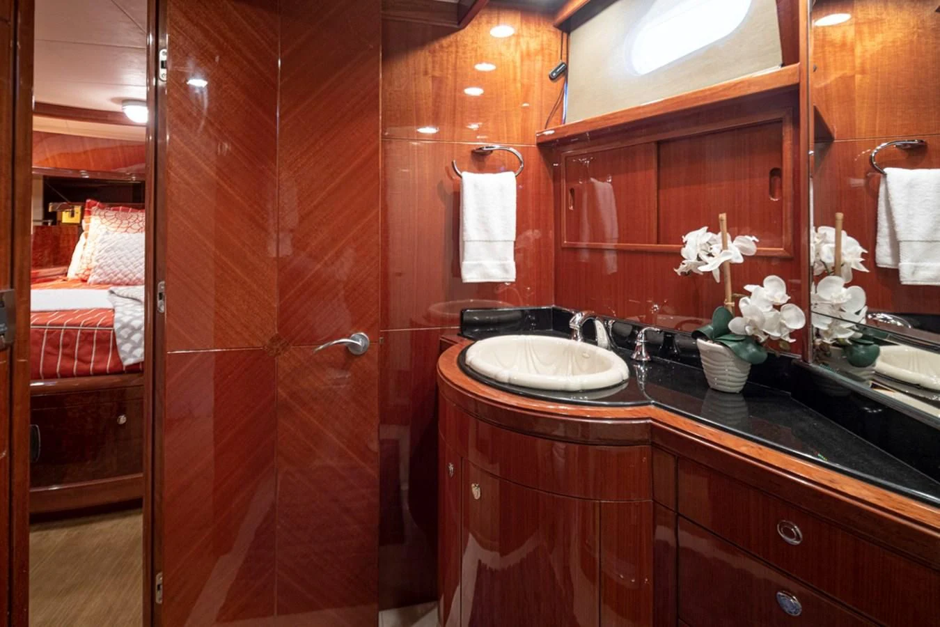 a bathroom with a sink and a mirror aboard COCONUT Yacht for Sale