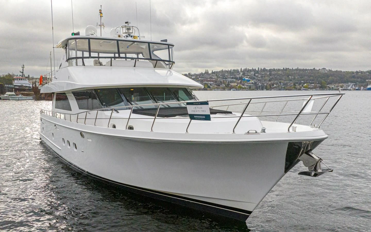 a white boat on the water aboard COCONUT Yacht for Sale