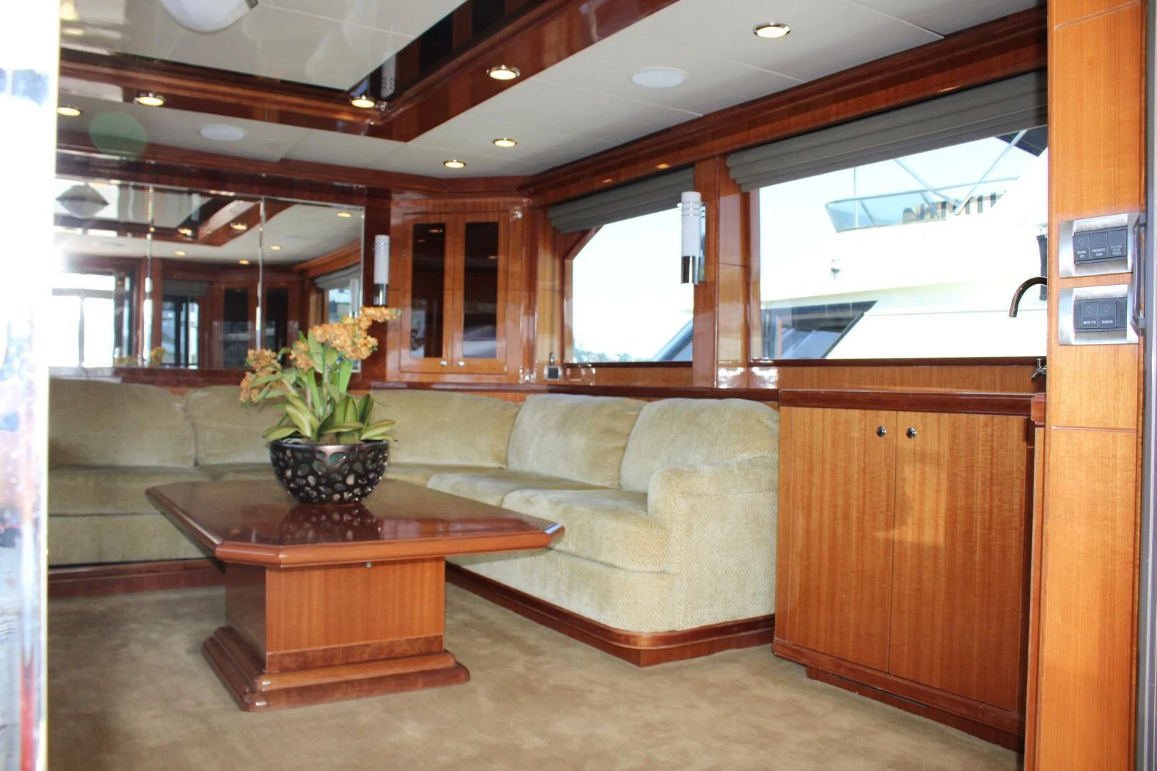 a living room with a couch and coffee table aboard COCONUT Yacht for Sale