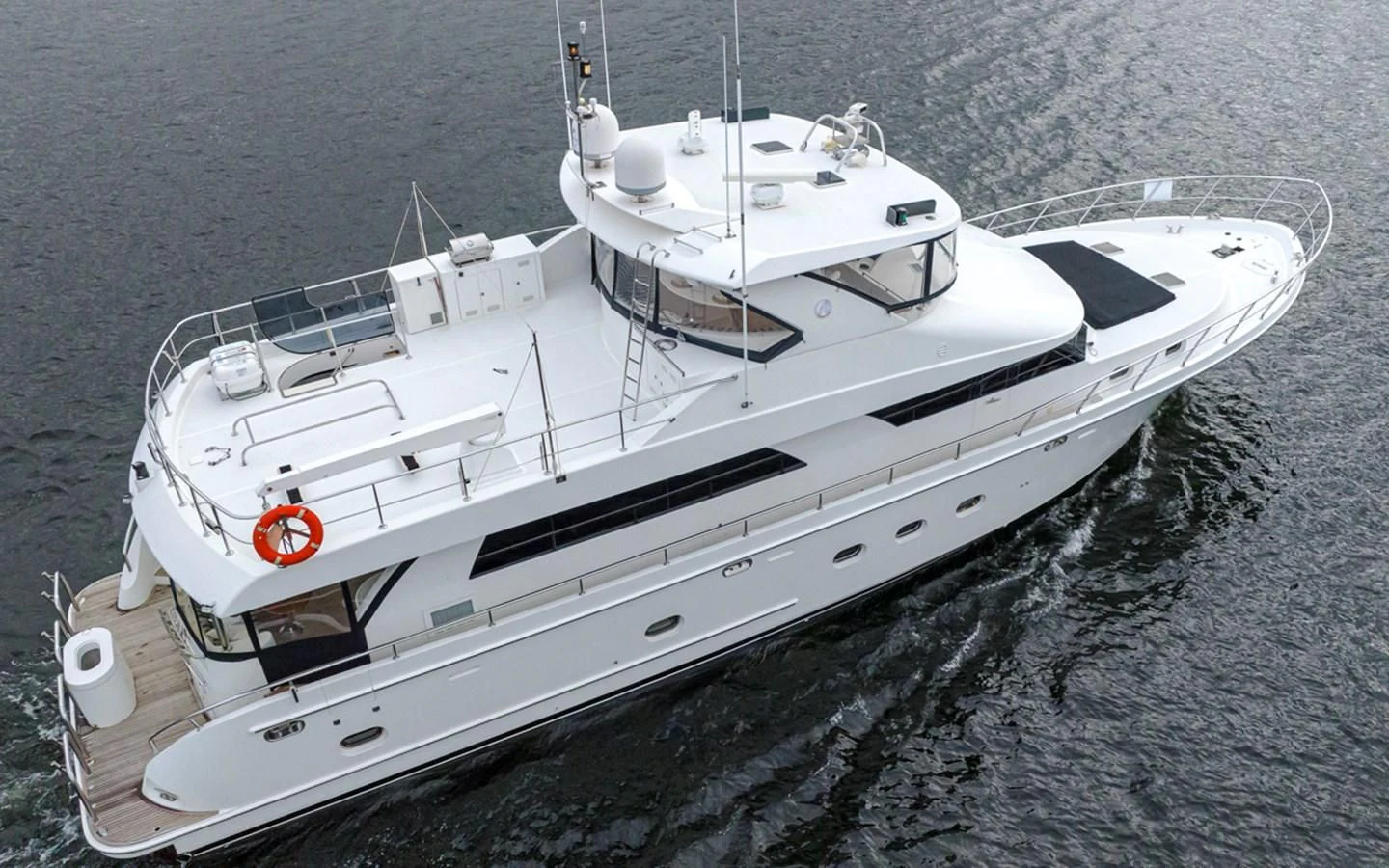 a white yacht on the water aboard COCONUT Yacht for Sale
