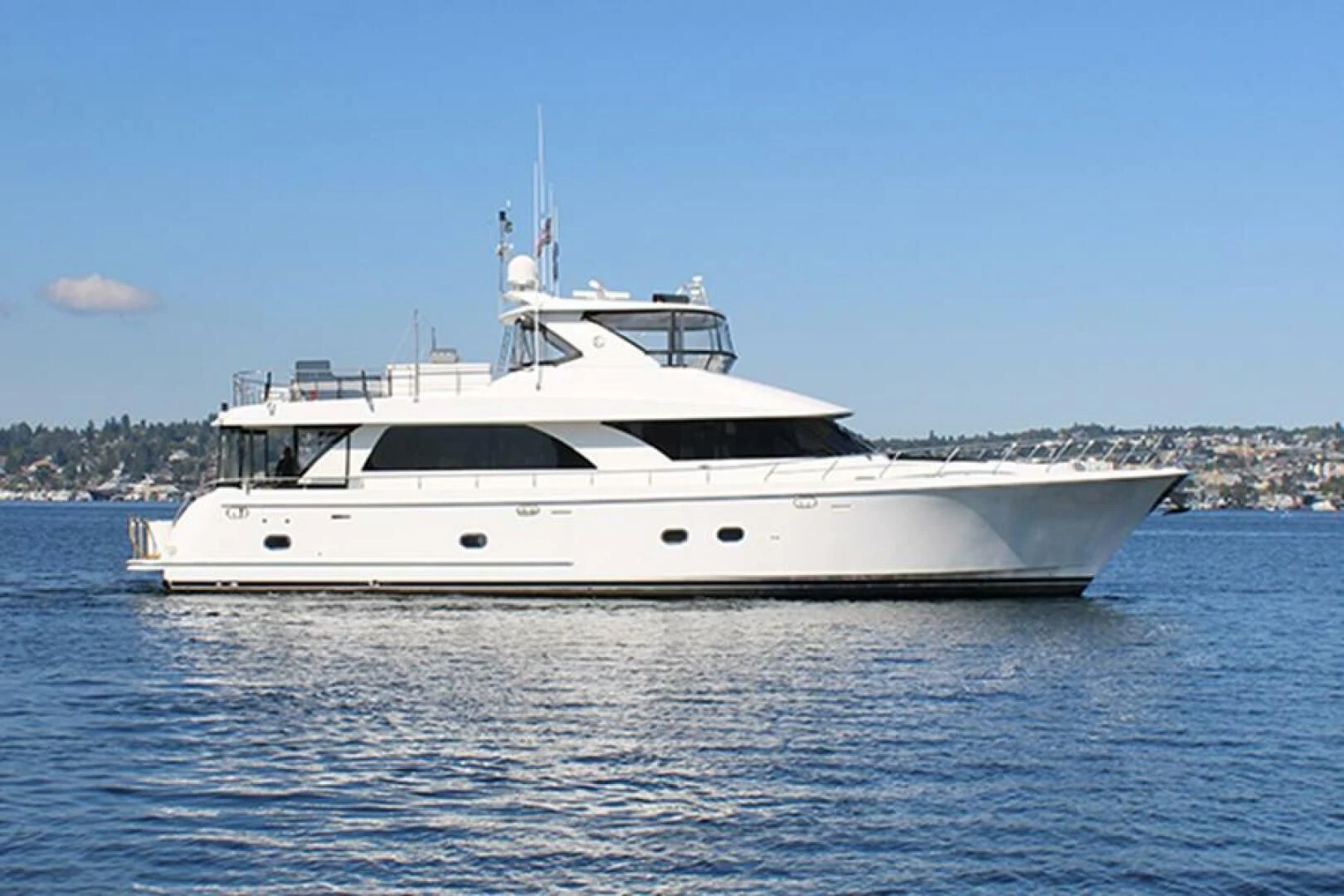 a white yacht on the water aboard COCONUT Yacht for Sale