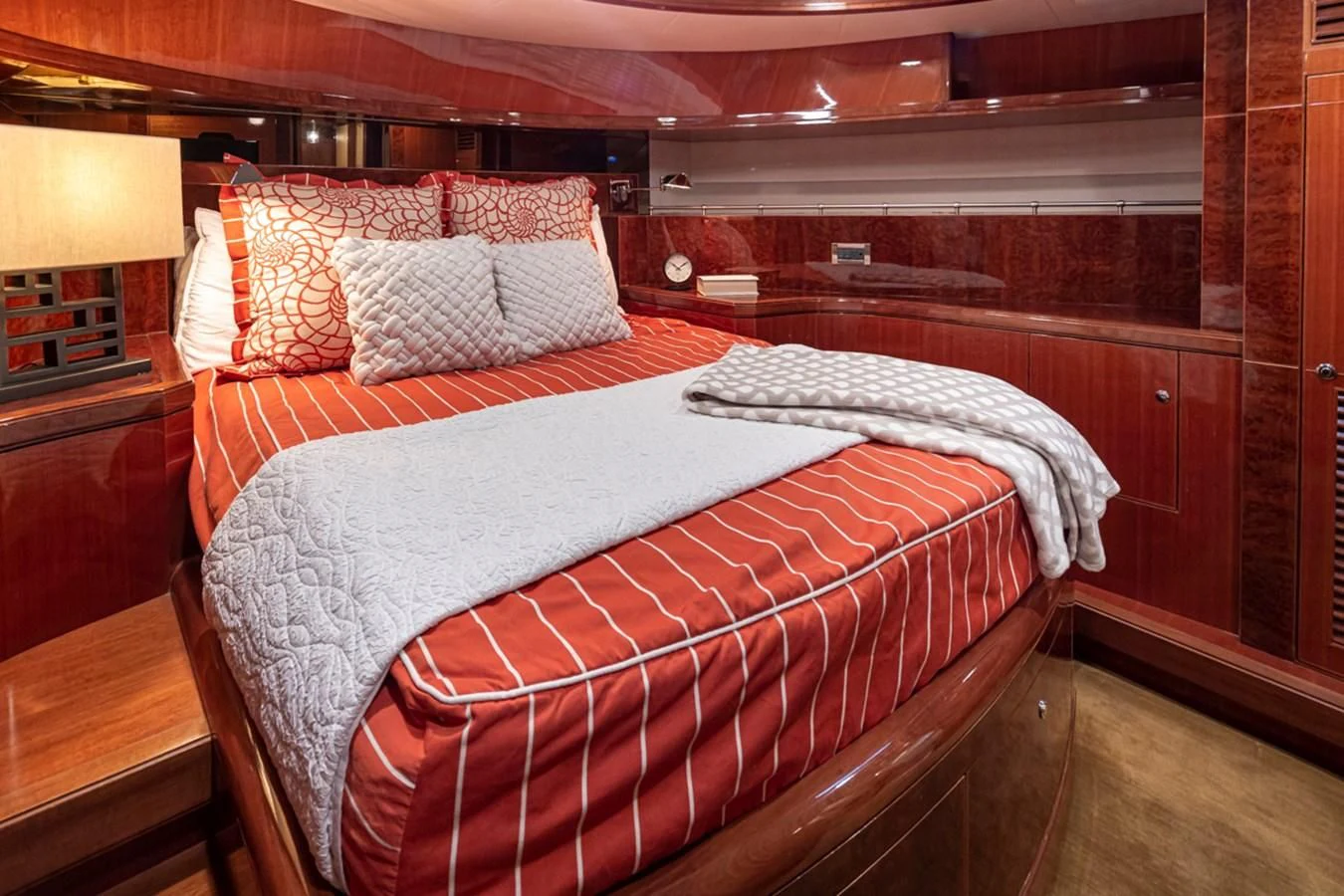 a bed with a red and white comforter aboard COCONUT Yacht for Sale