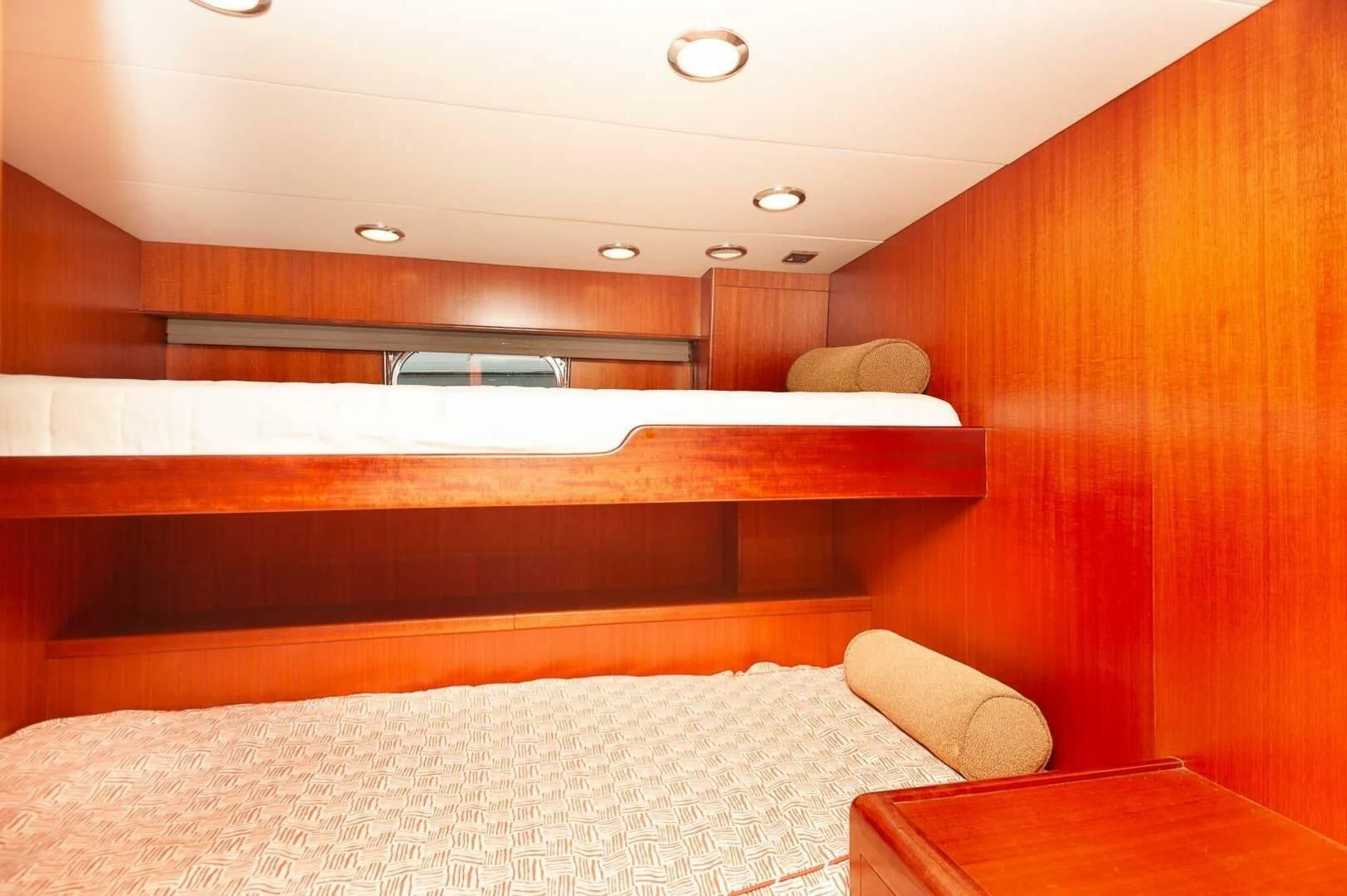 a room with a bed and a table aboard COCONUT Yacht for Sale