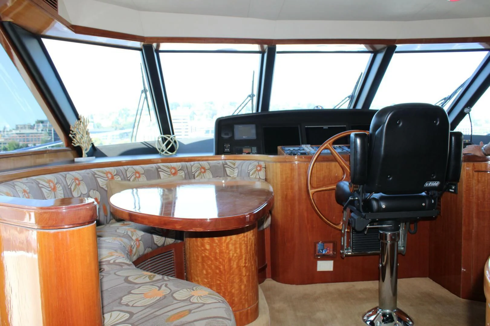 a table and chairs in a room aboard COCONUT Yacht for Sale