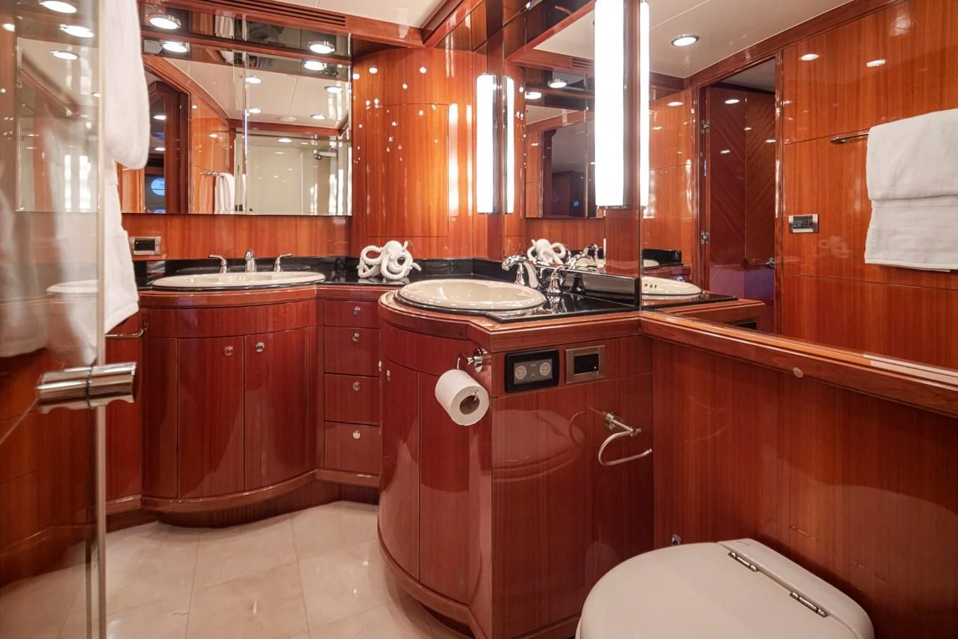 a bathroom with wooden cabinets aboard COCONUT Yacht for Sale