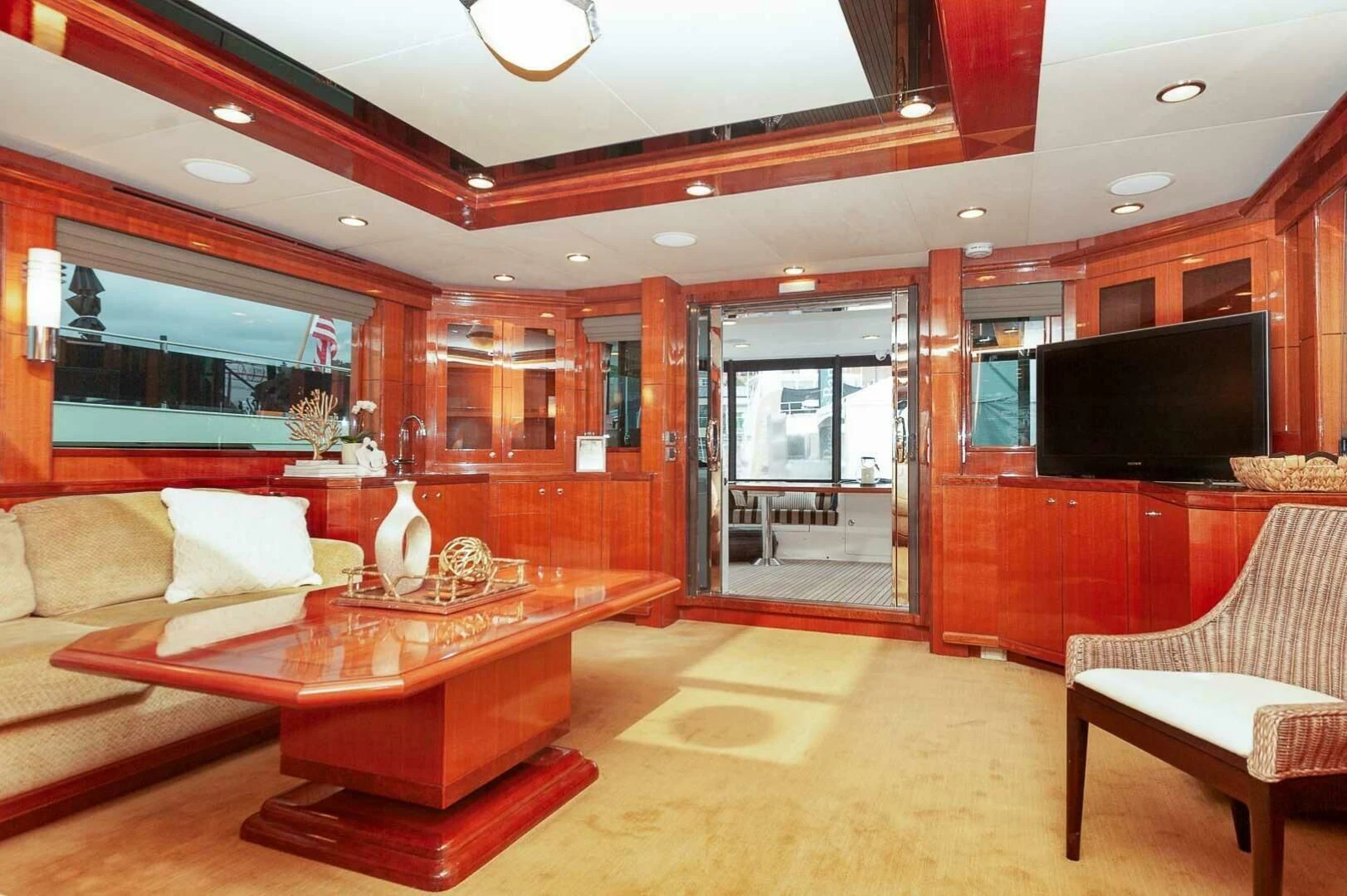 a living room with a large fireplace aboard COCONUT Yacht for Sale