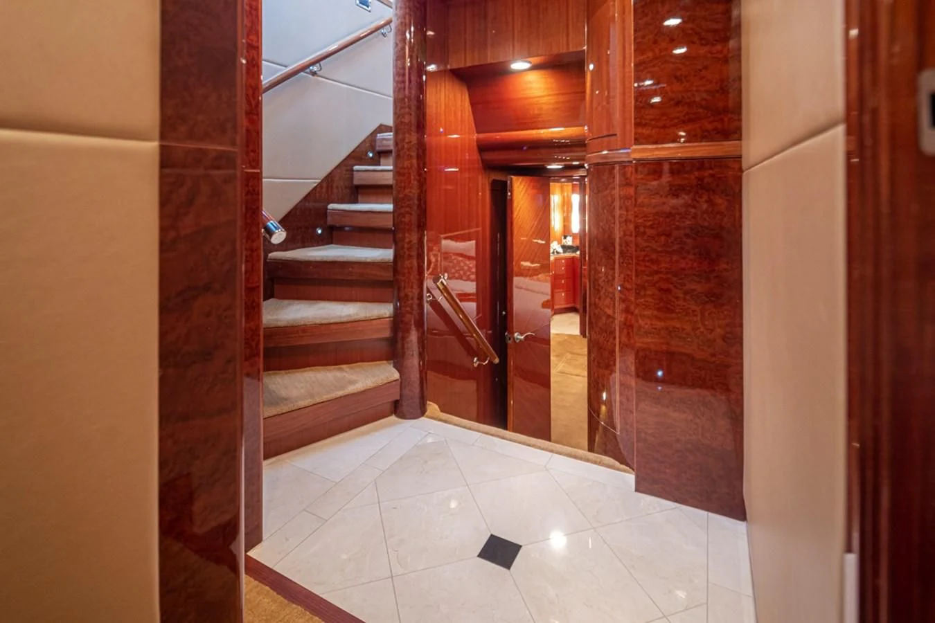 a hallway with a door and a staircase aboard COCONUT Yacht for Sale