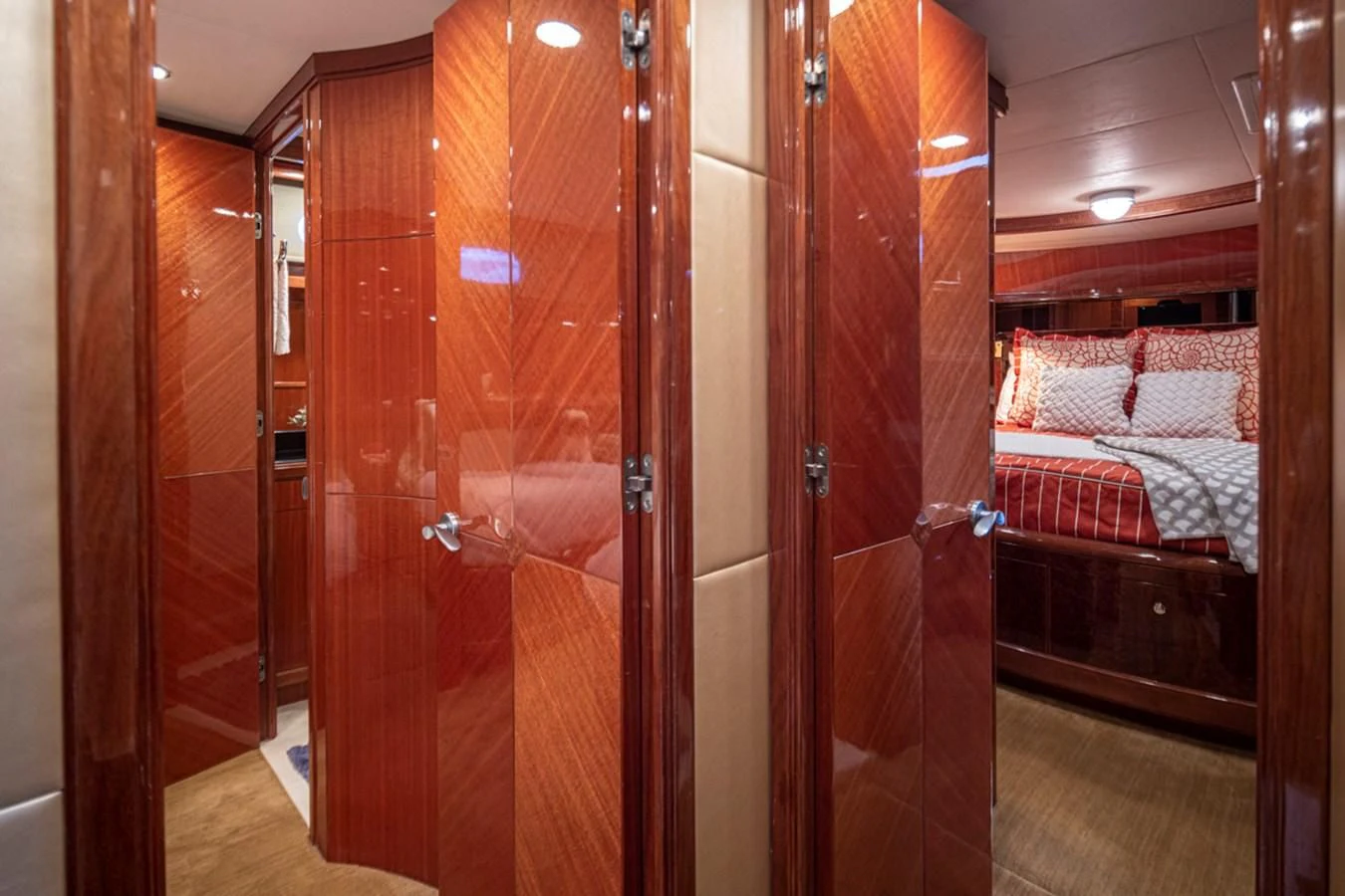 a room with a bed and a closet aboard COCONUT Yacht for Sale