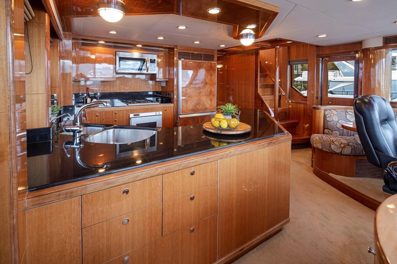 a kitchen with a large island aboard COCONUT Yacht for Sale