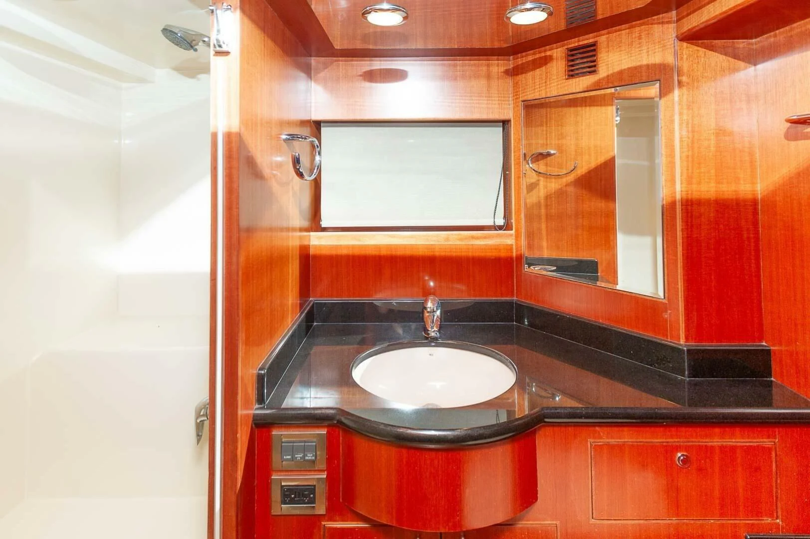 a bathroom with a sink and cabinets aboard COCONUT Yacht for Sale