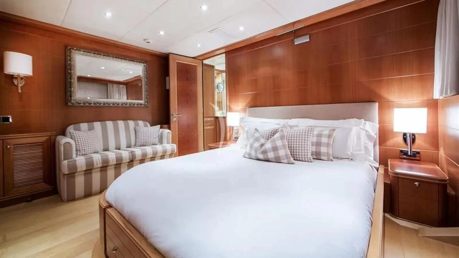 a room with a bed and a couch aboard BENIK Yacht for Charter