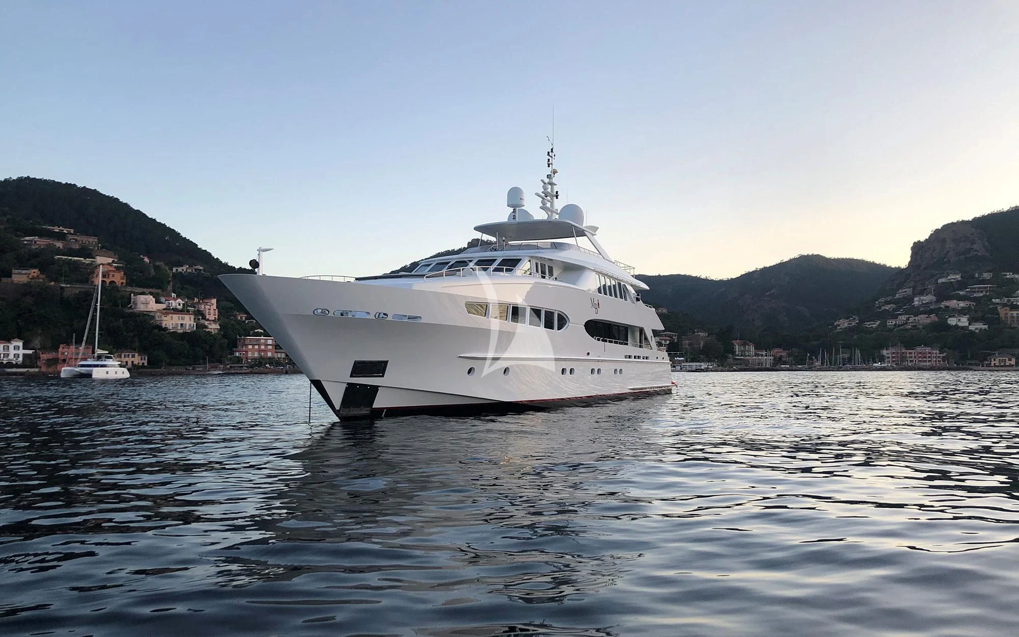a white boat in the water aboard BENIK Yacht for Charter