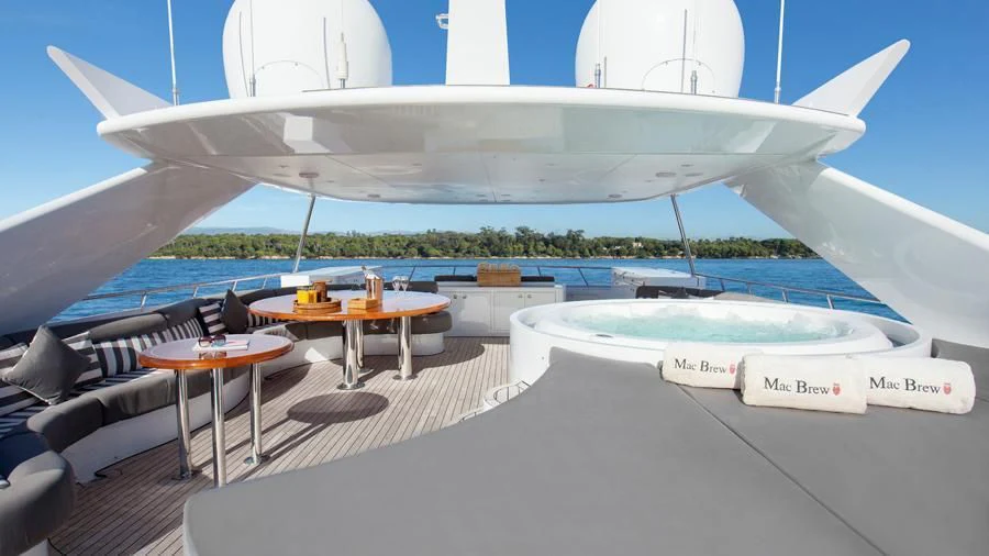 a plane wing with tables and chairs aboard BENIK Yacht for Charter