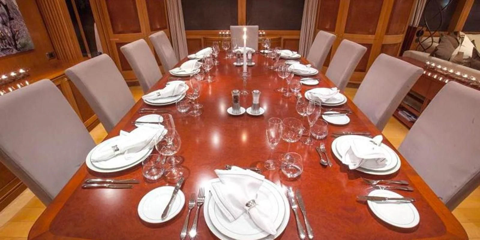 a table set with plates and silverware aboard BENIK Yacht for Charter