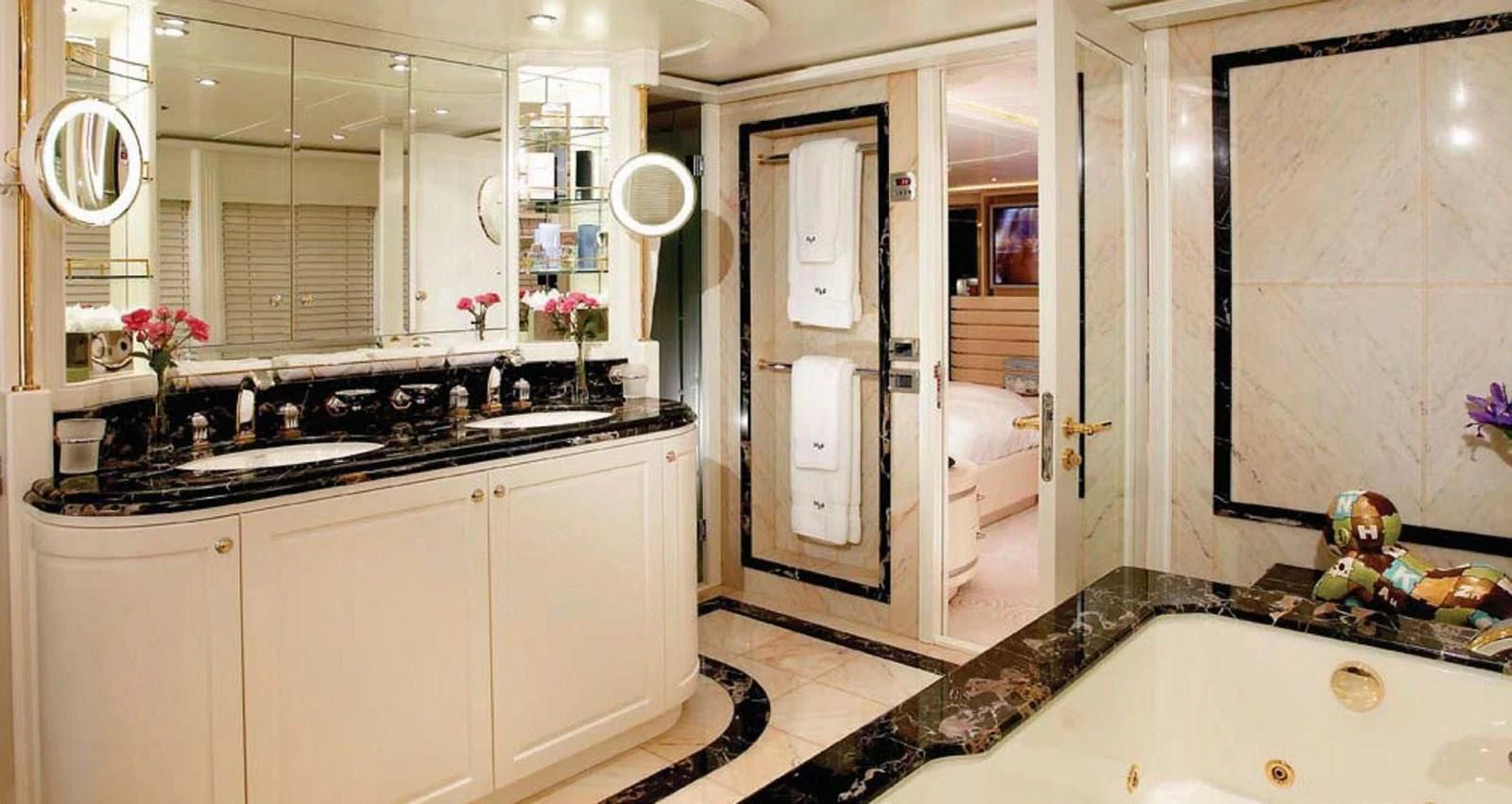 a bathroom with a large mirror aboard BENIK Yacht for Charter