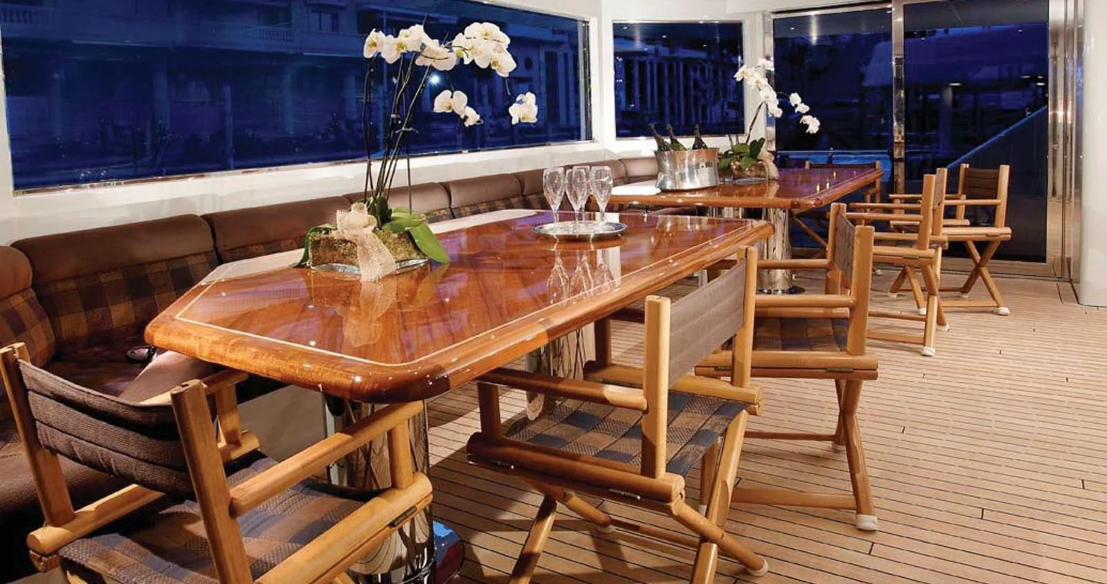 a table with chairs around it aboard BENIK Yacht for Charter