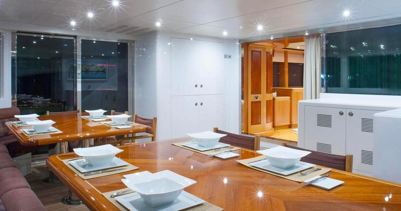 a large kitchen with a table and chairs aboard BENIK Yacht for Charter