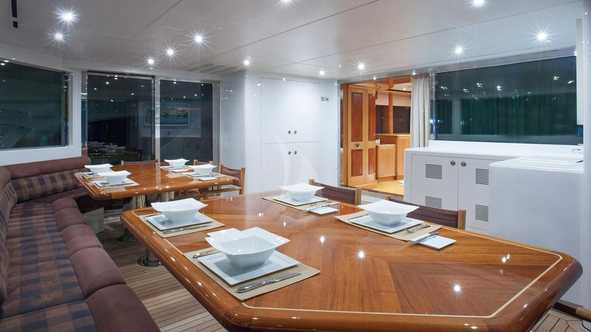 a large kitchen with a table and chairs aboard BENIK Yacht for Charter