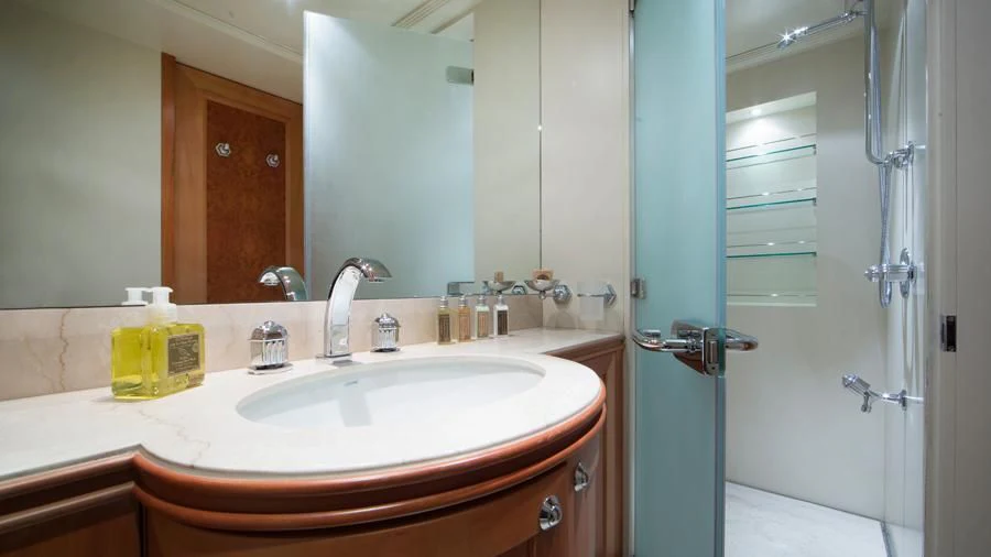 a bathroom with a sink and a shower aboard BENIK Yacht for Charter