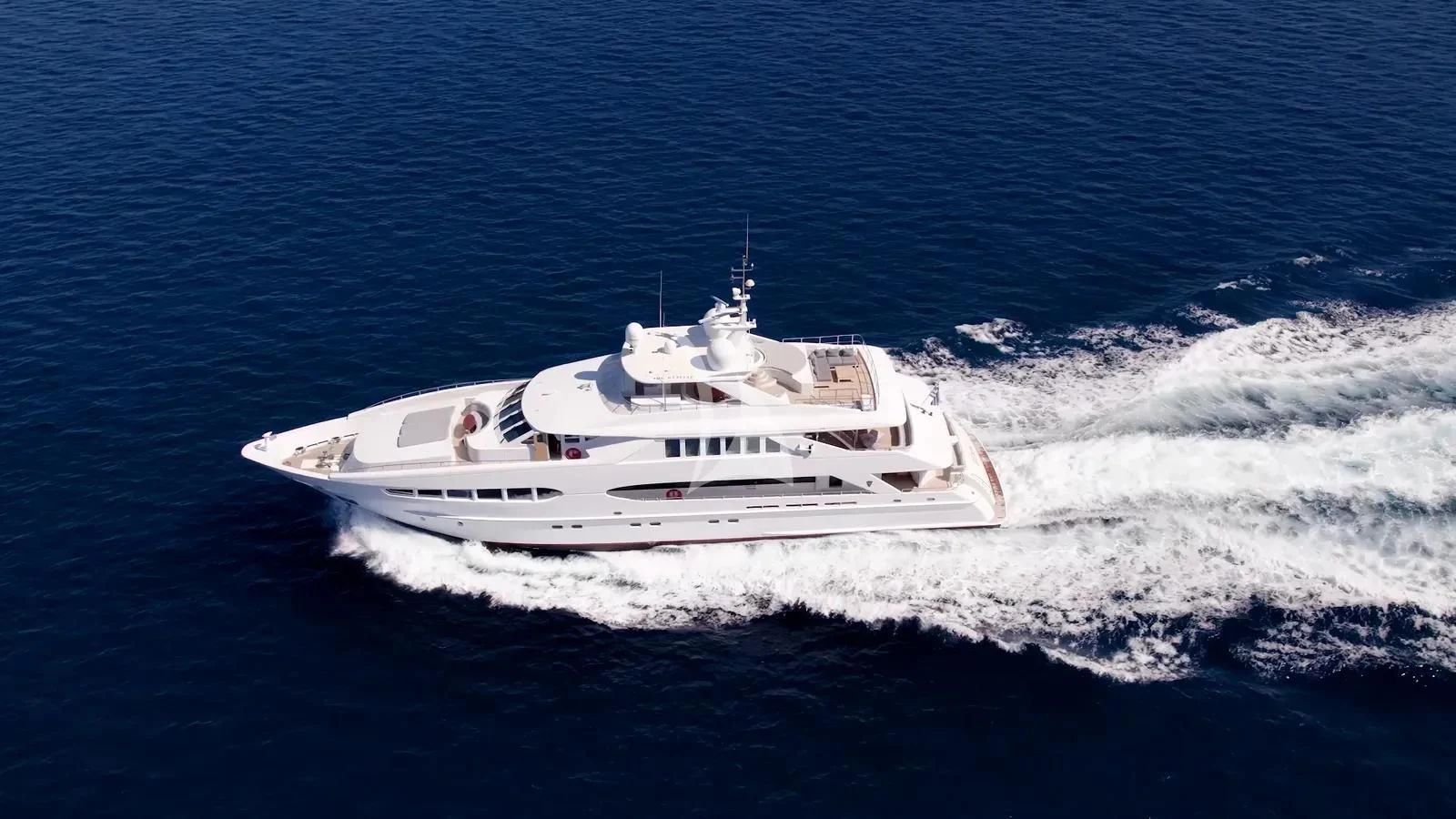a white boat on the water aboard BENIK Yacht for Charter