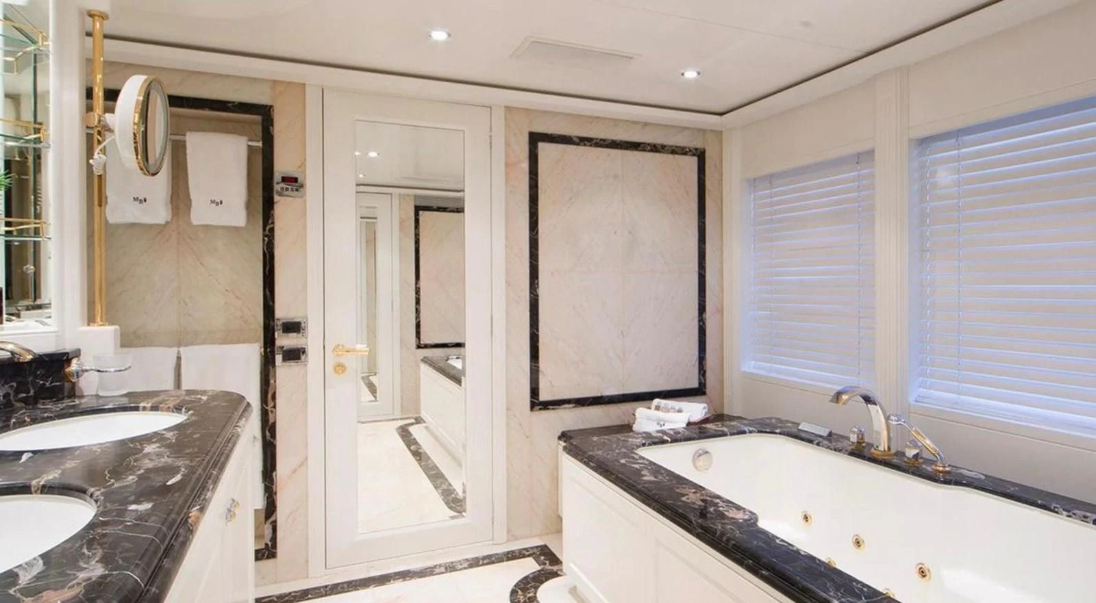 a bathroom with a sink and a mirror aboard BENIK Yacht for Charter