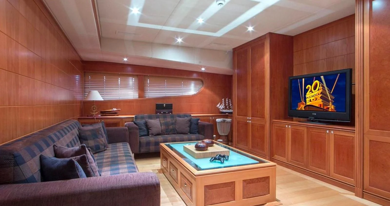 a living room with a tv and a couch aboard BENIK Yacht for Charter