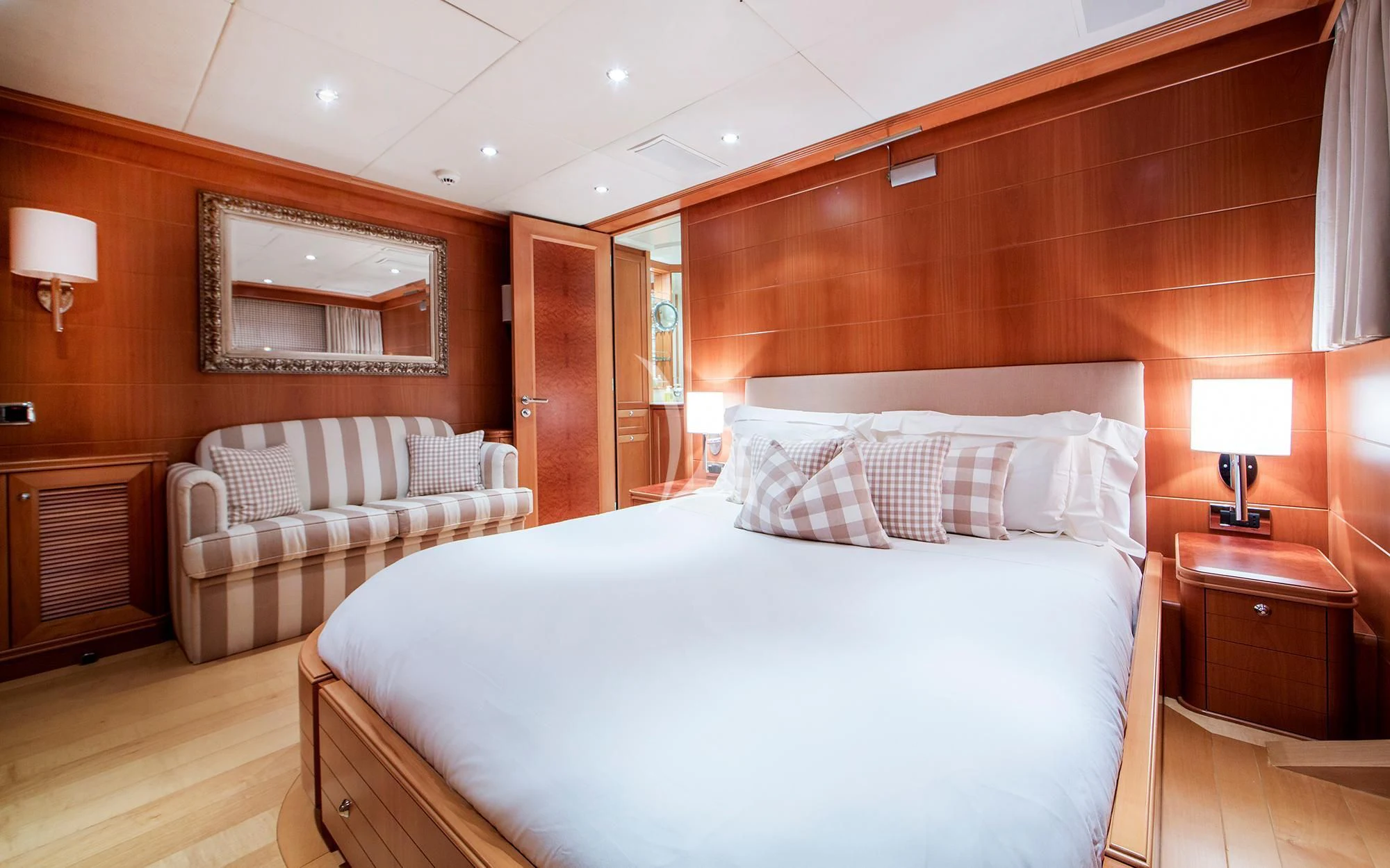 a room with a bed and a couch aboard BENIK Yacht for Charter