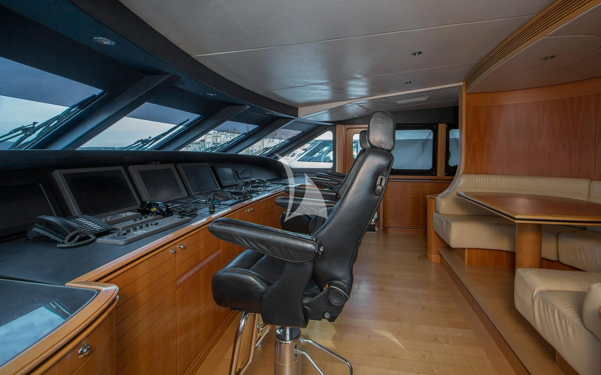 a vehicle with a seat and a desk in the back aboard BENIK Yacht for Charter