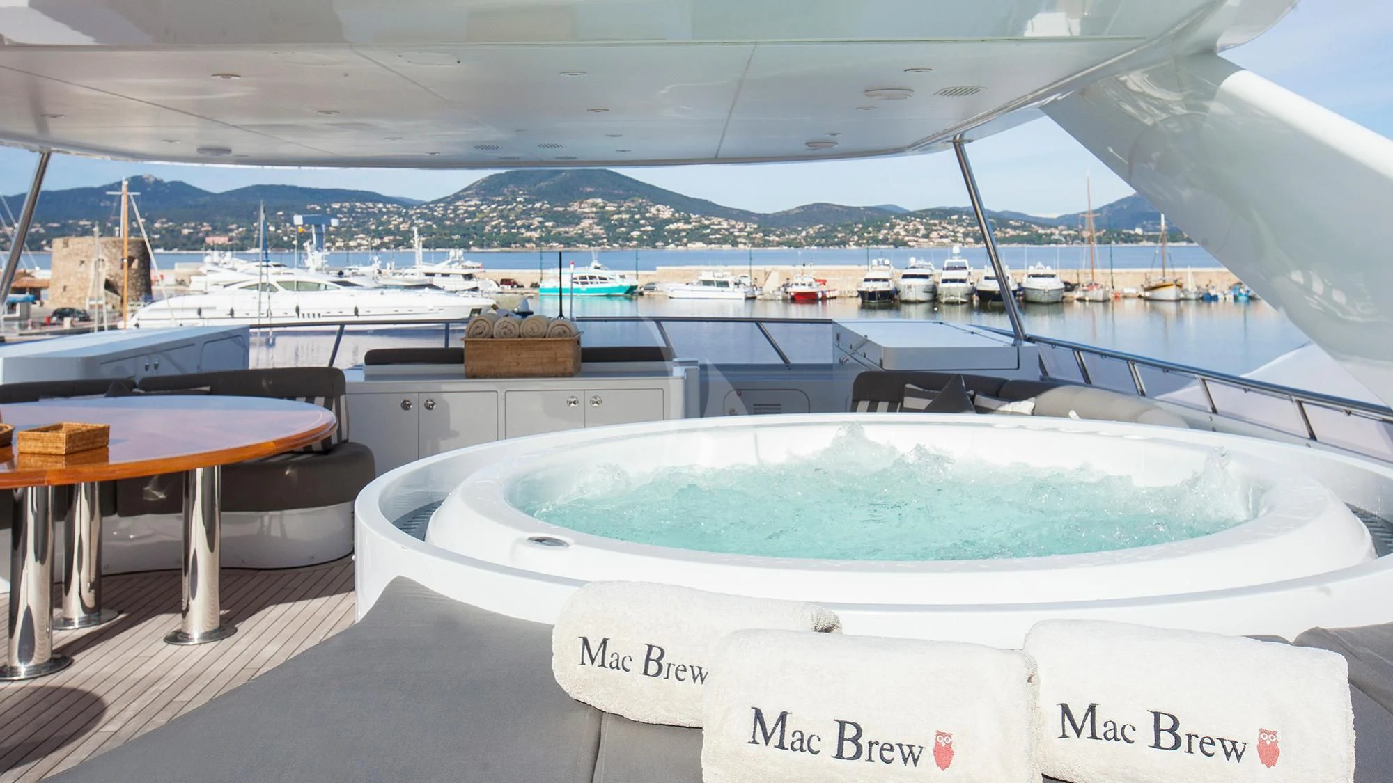 a large white boat with a large pool in it aboard BENIK Yacht for Charter
