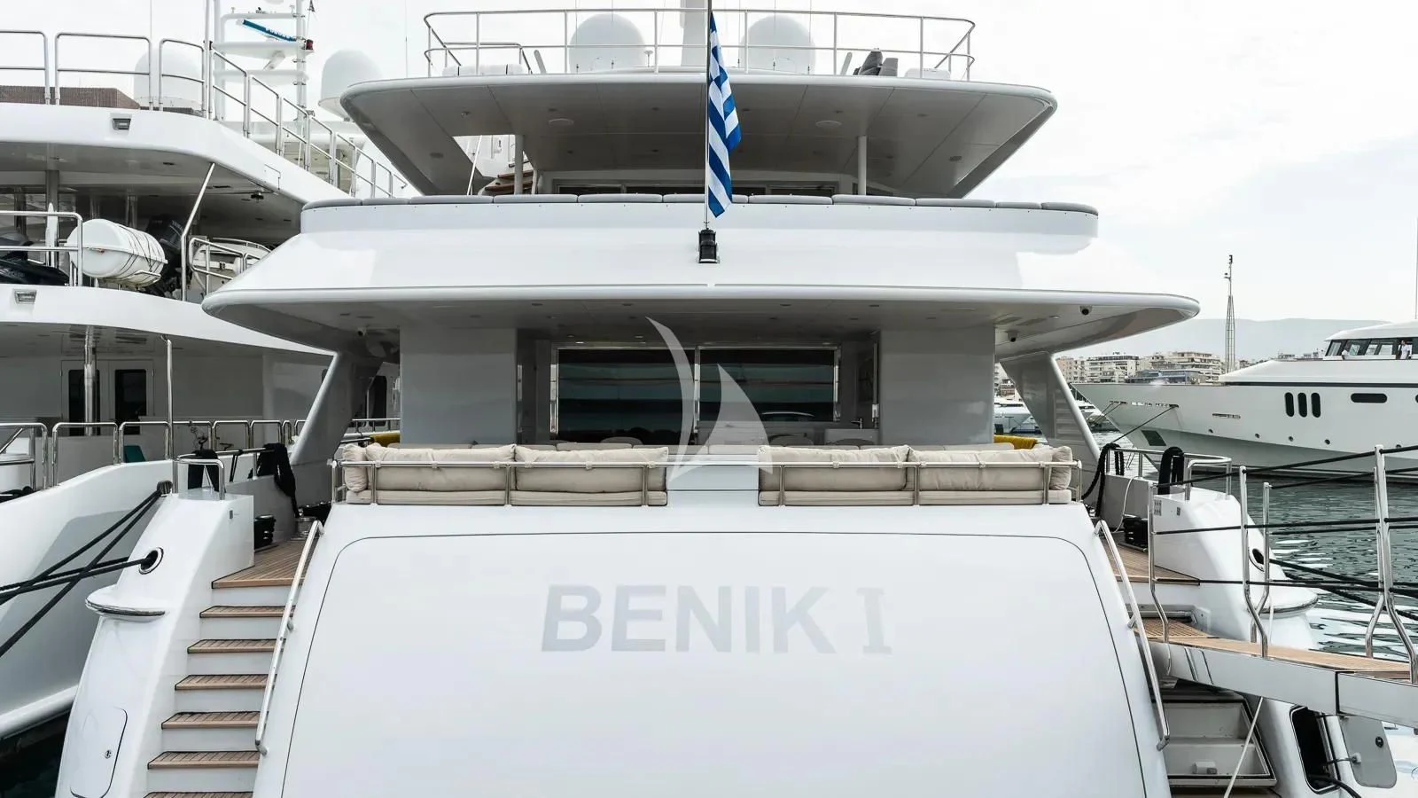 a building with a white roof and a blue flag on top aboard BENIK Yacht for Charter